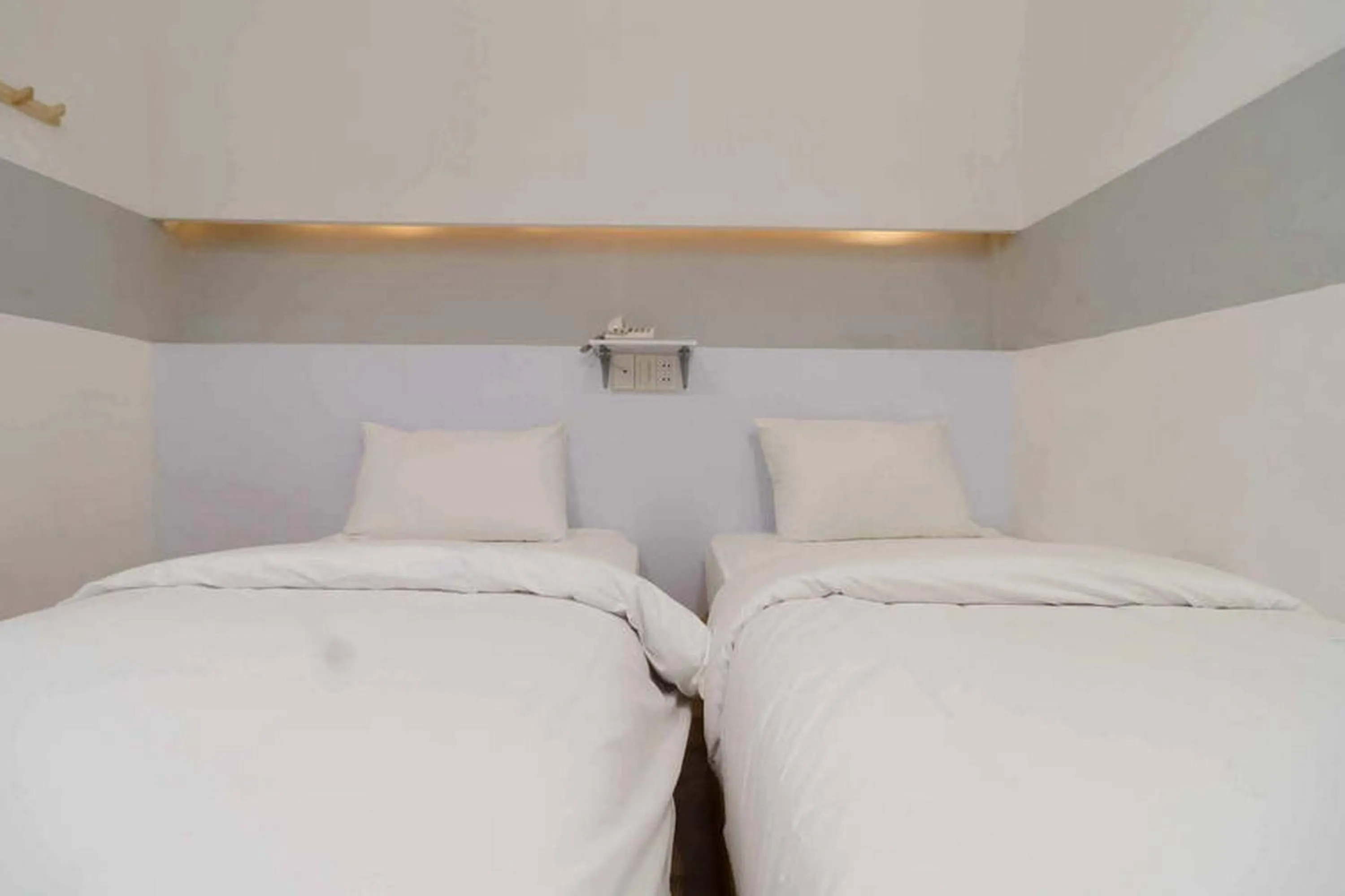 Bed in RedDoorz at Jotel Guest House Medan