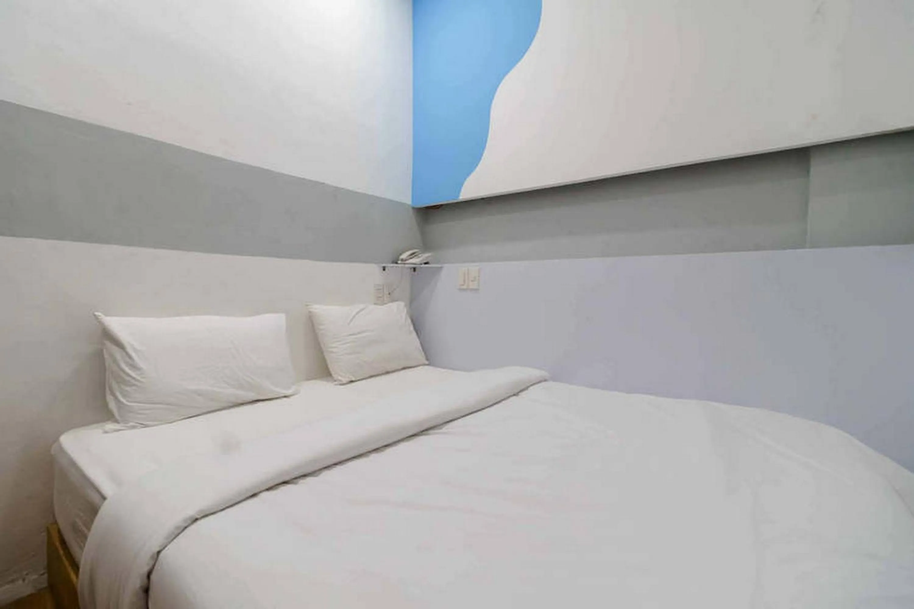 Bed in RedDoorz at Jotel Guest House Medan