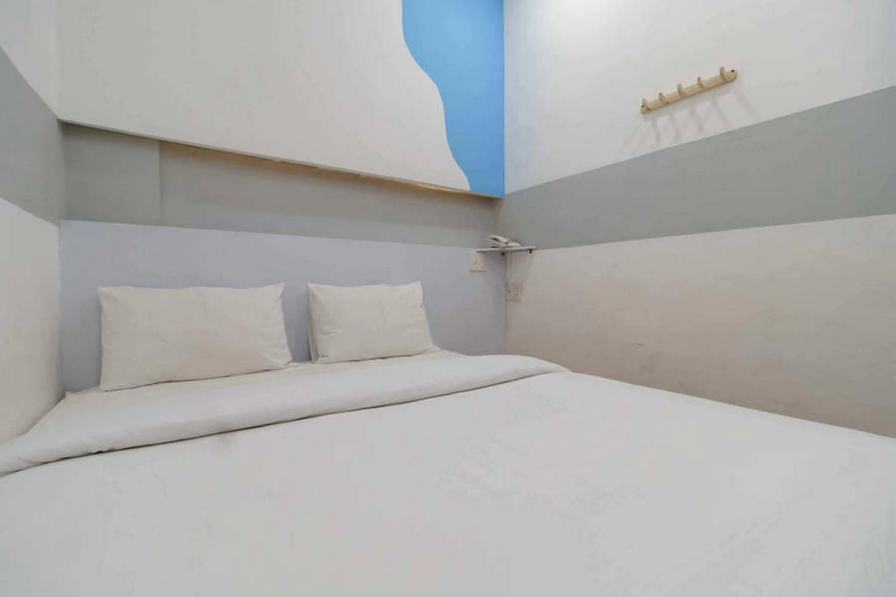 Bed in RedDoorz at Jotel Guest House Medan