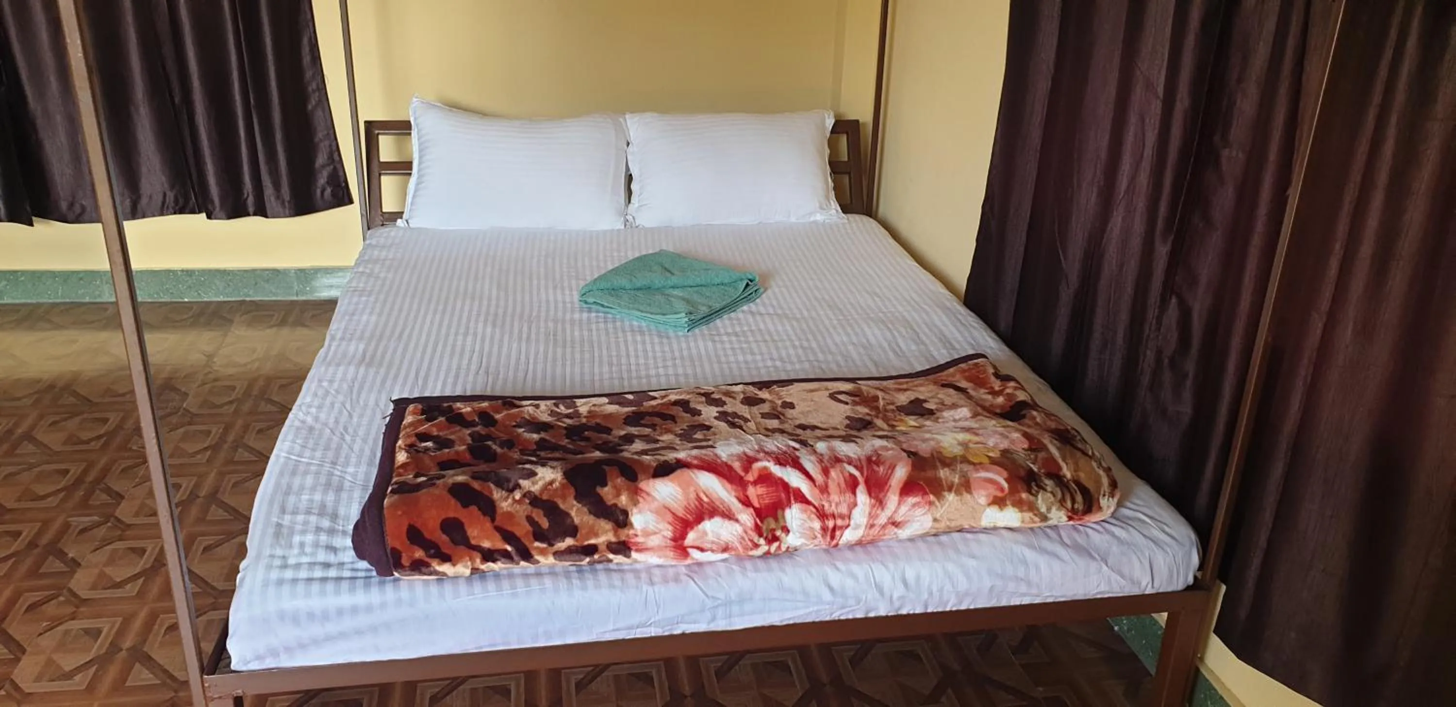 Bed in Elephant Garden Hotel and Resort Pvt Ltd