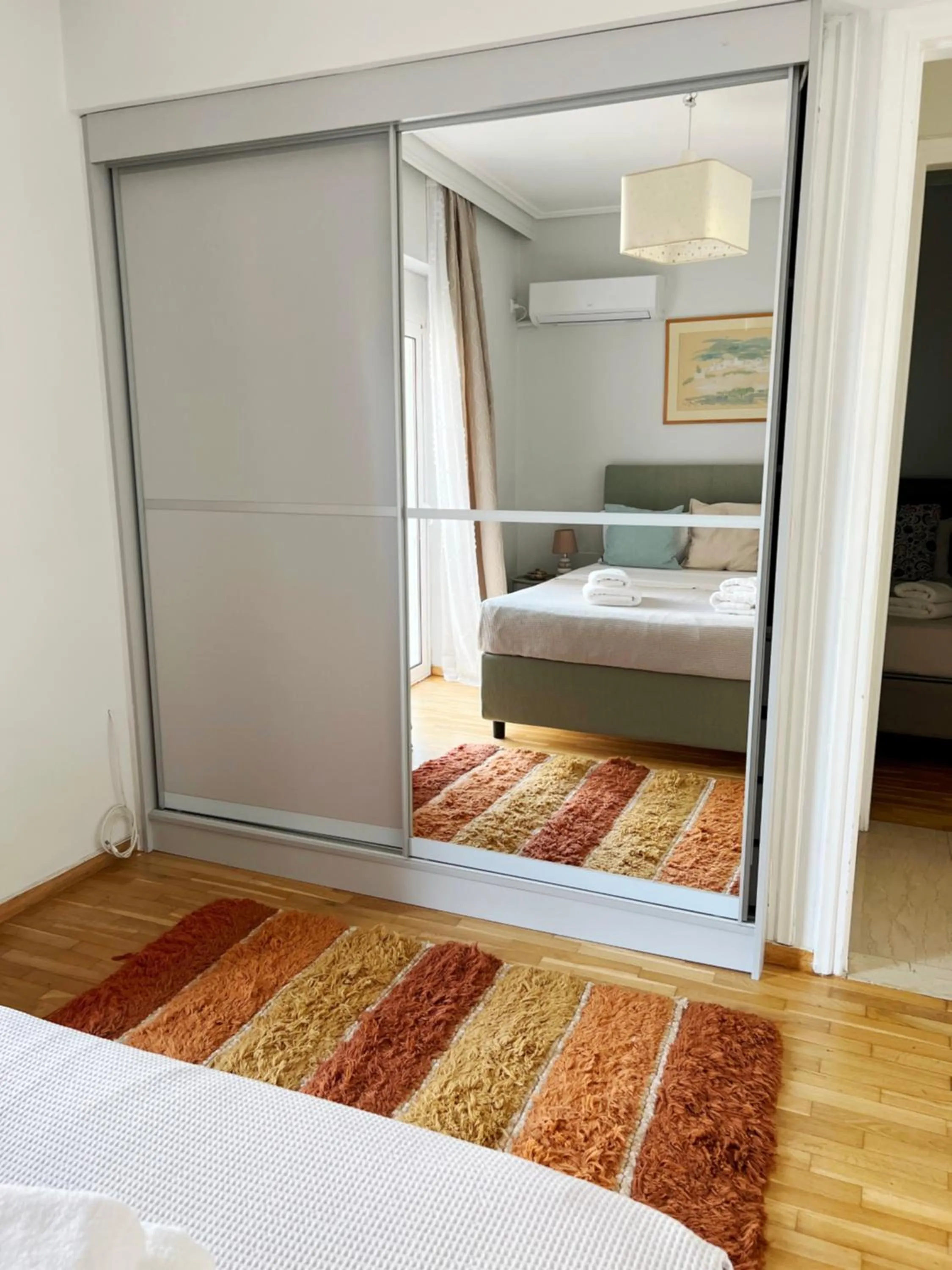 Bed in Peaceful Apartment by Flisvos Marina by Athenian Homes