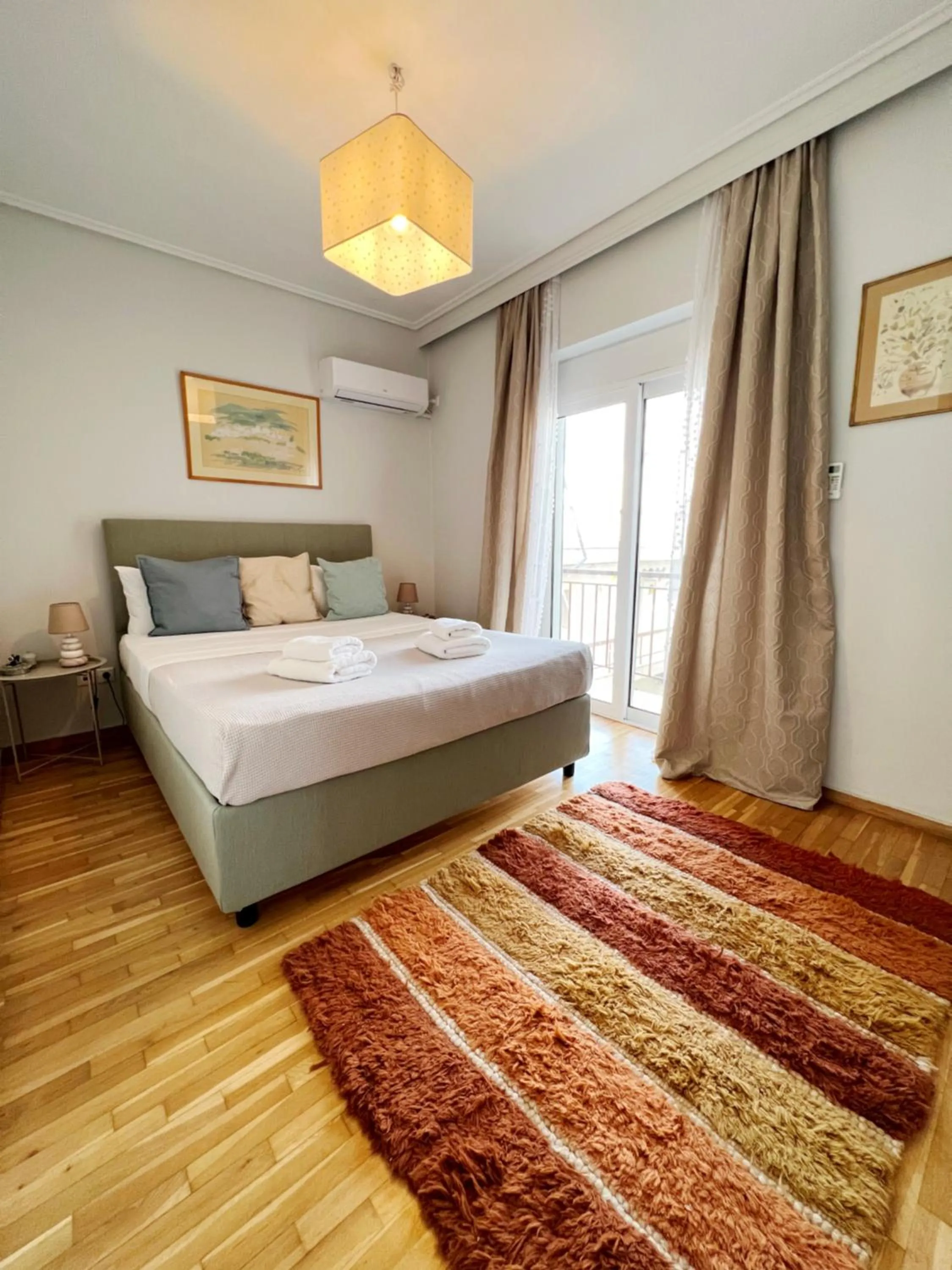 Bed in Peaceful Apartment by Flisvos Marina by Athenian Homes