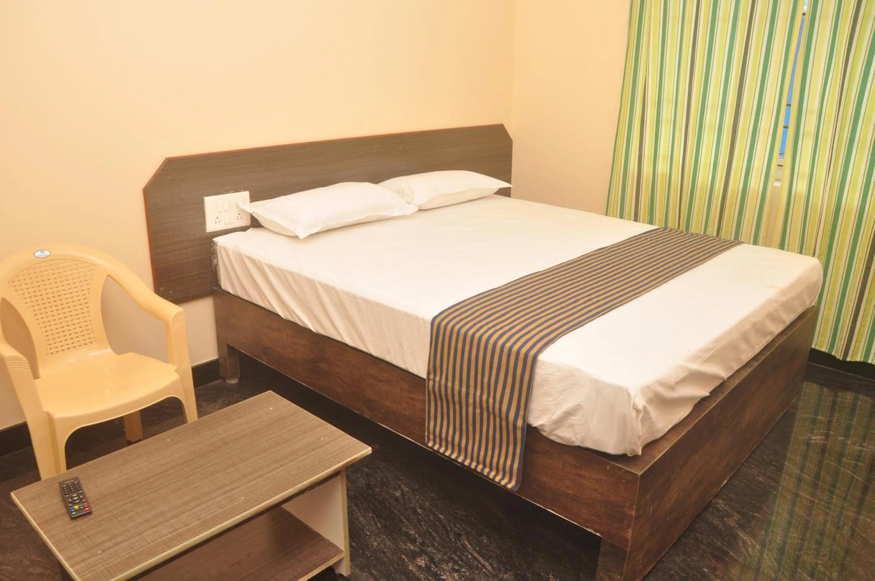 Bed in Hotel Aishwariyam