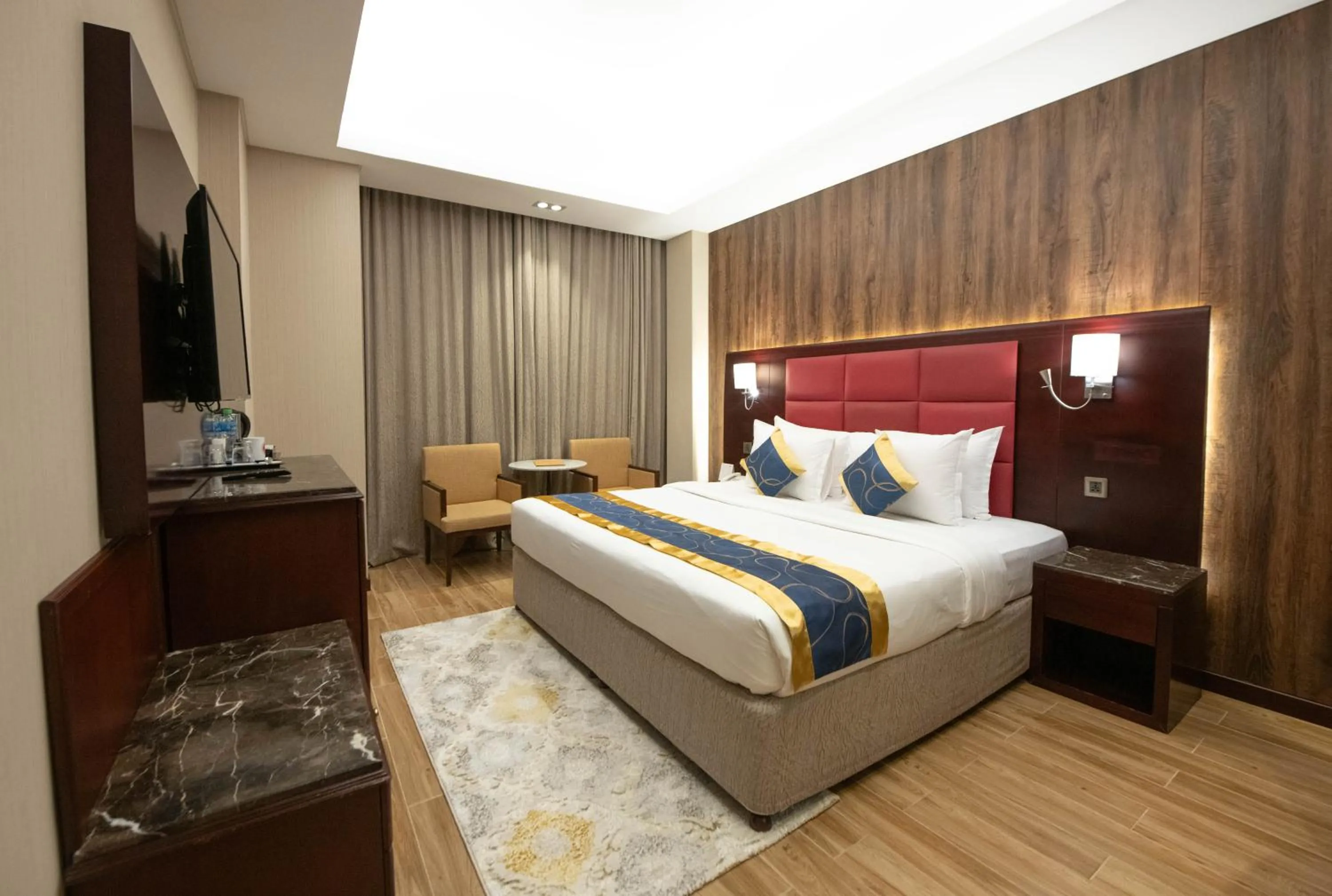 Bed in Ramee Guestline Hotel