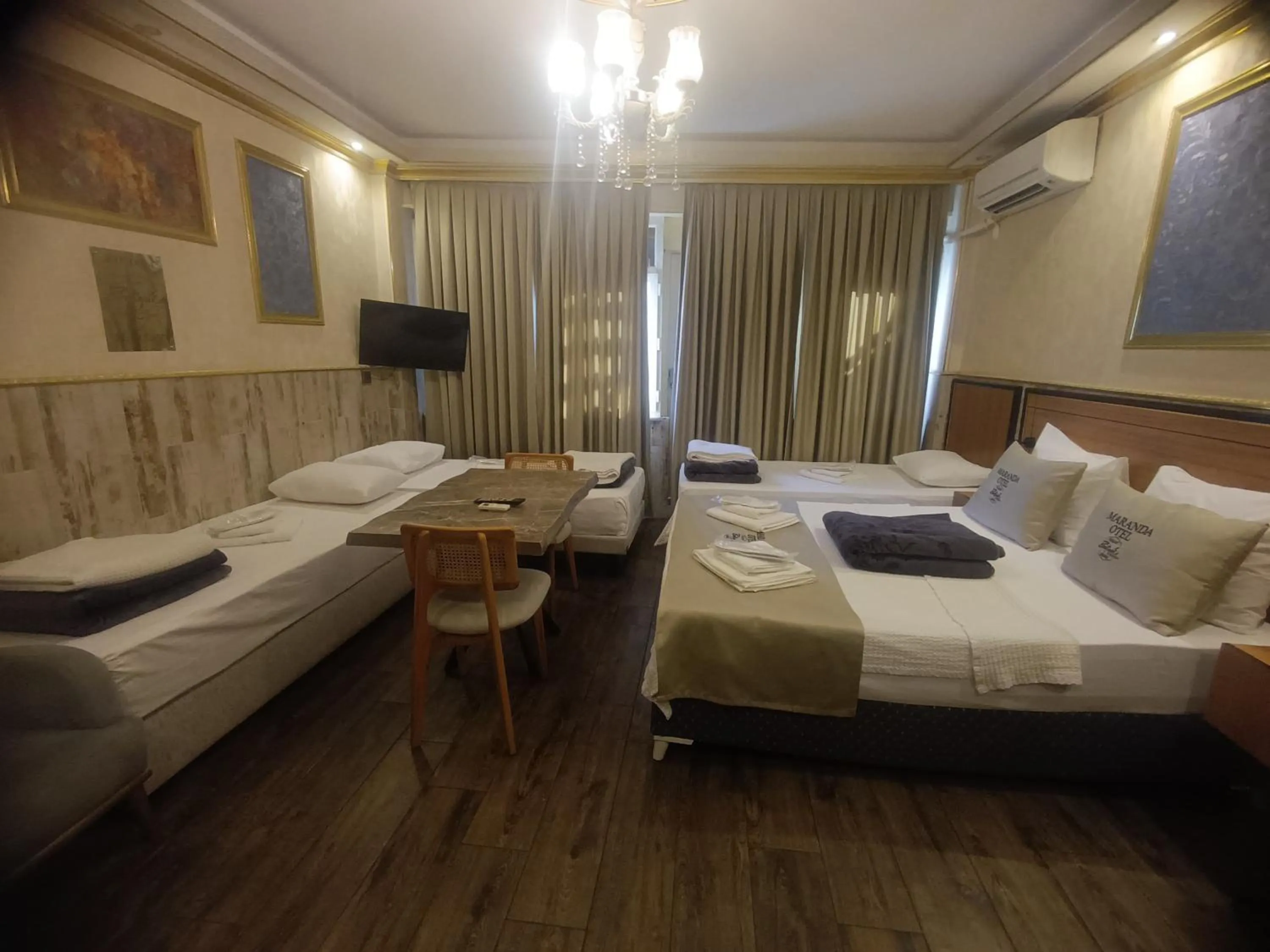 Living room, Bed in Maranda Suit Hotel