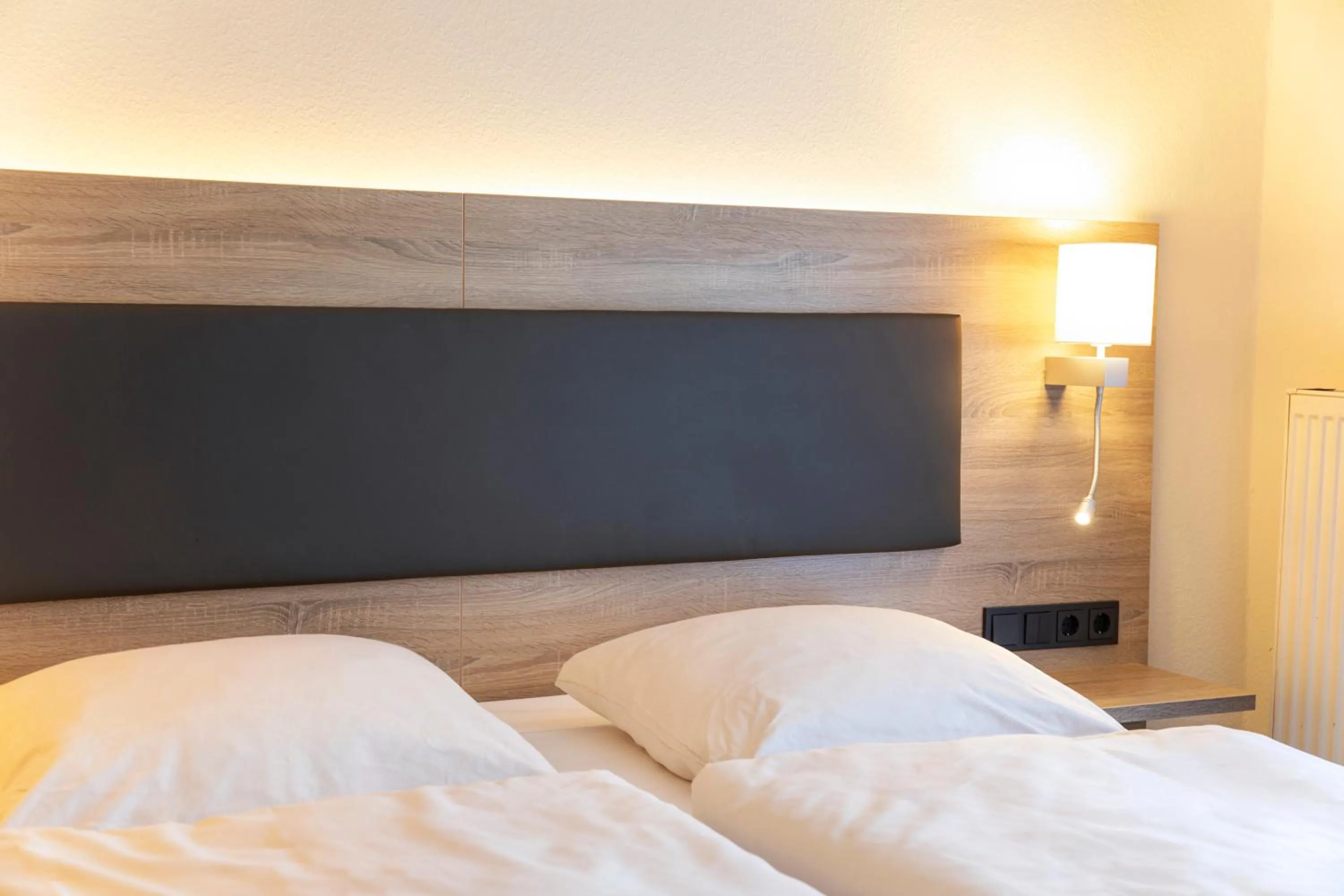 Photo of the whole room, Bed in Hotel Lohr am Main by Michel Hotels