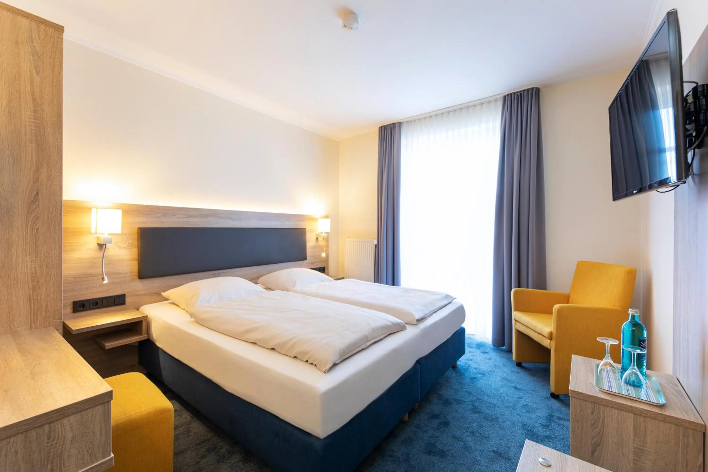 Photo of the whole room, Bed in Hotel Lohr am Main by Michel Hotels