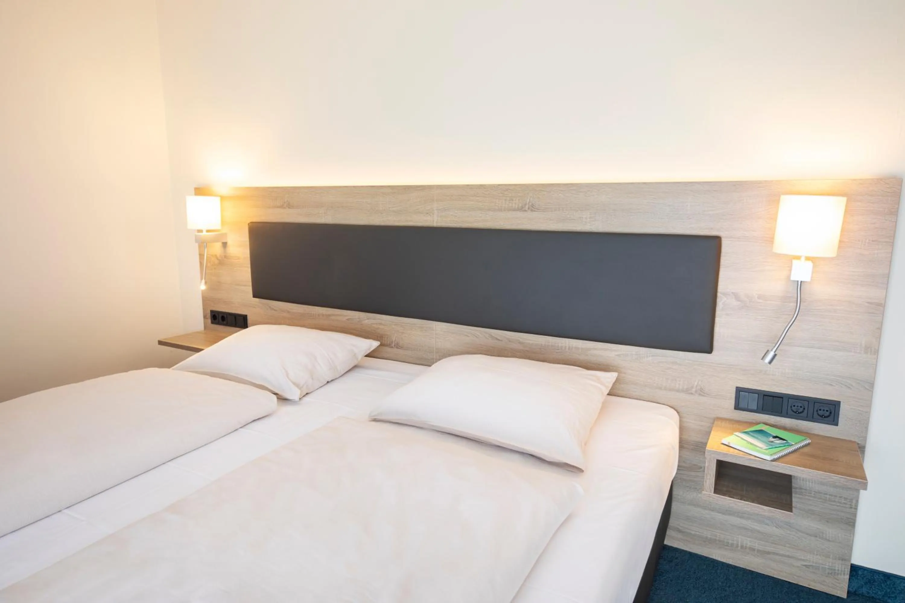 Photo of the whole room, Bed in Hotel Lohr am Main by Michel Hotels