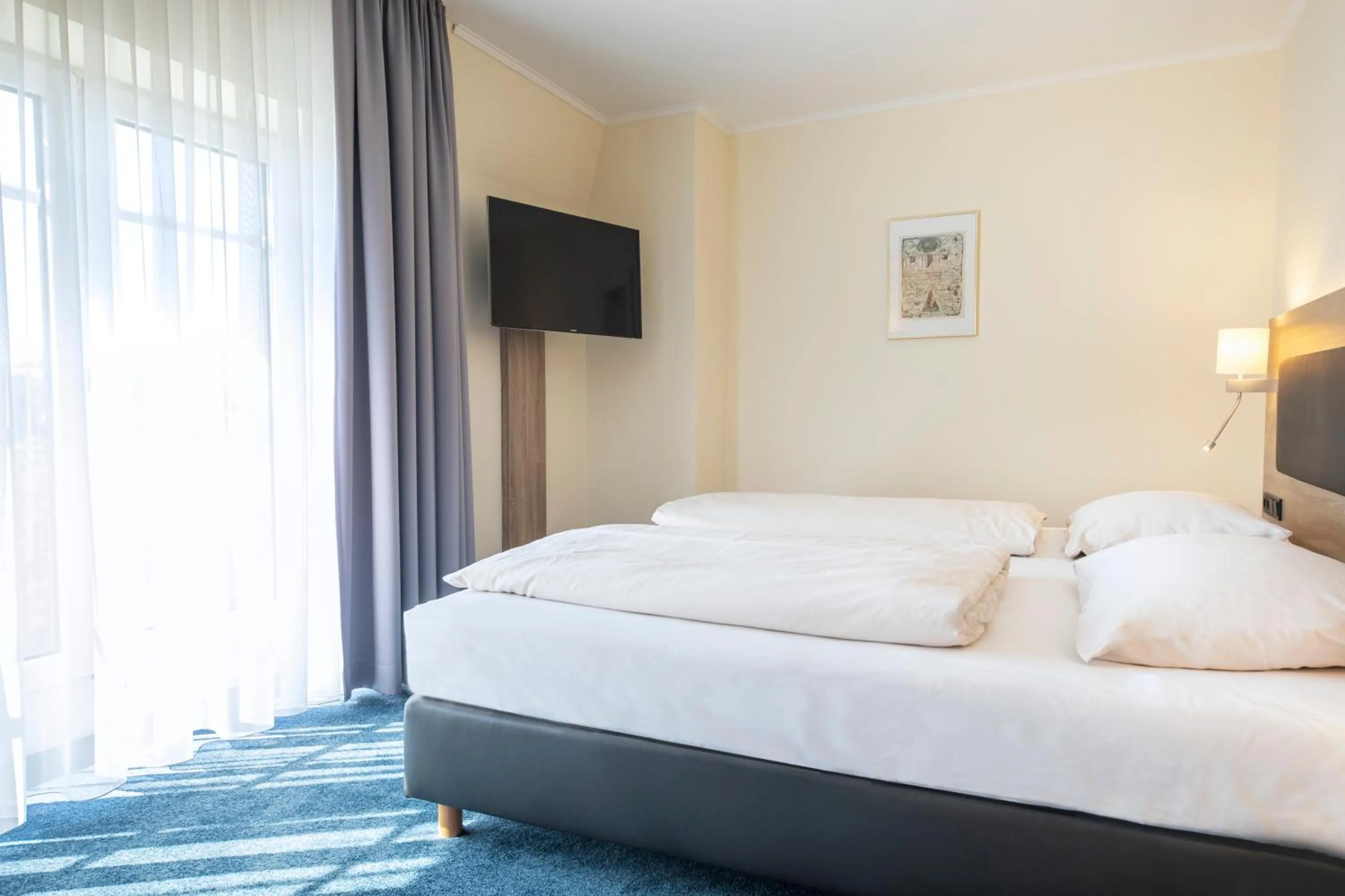 Photo of the whole room, Bed in Hotel Lohr am Main by Michel Hotels