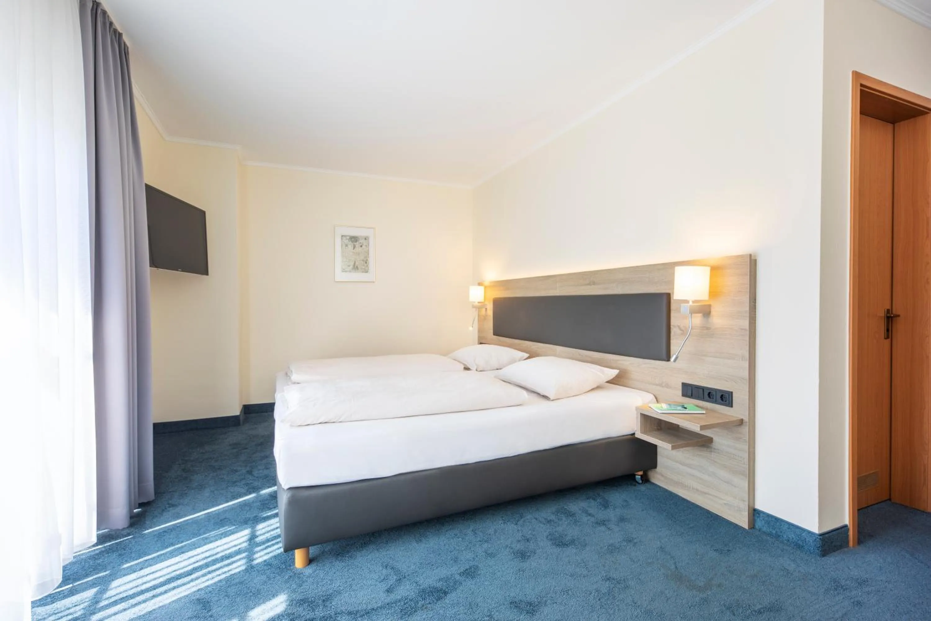 Photo of the whole room, Bed in Hotel Lohr am Main by Michel Hotels