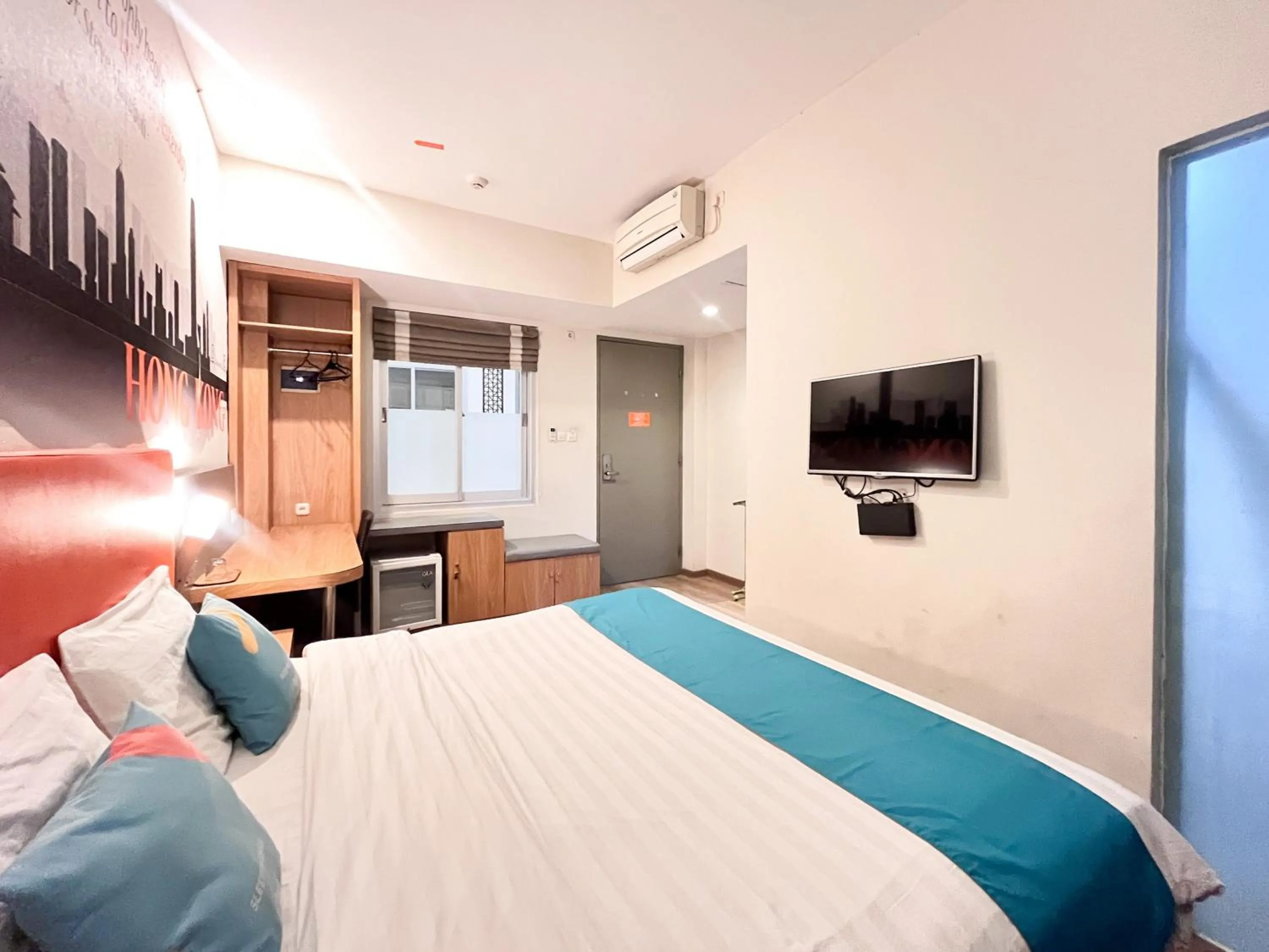 Bedroom, Bed in Sans Vibes Hotel Syariah Graha 100 Gubeng Surabaya