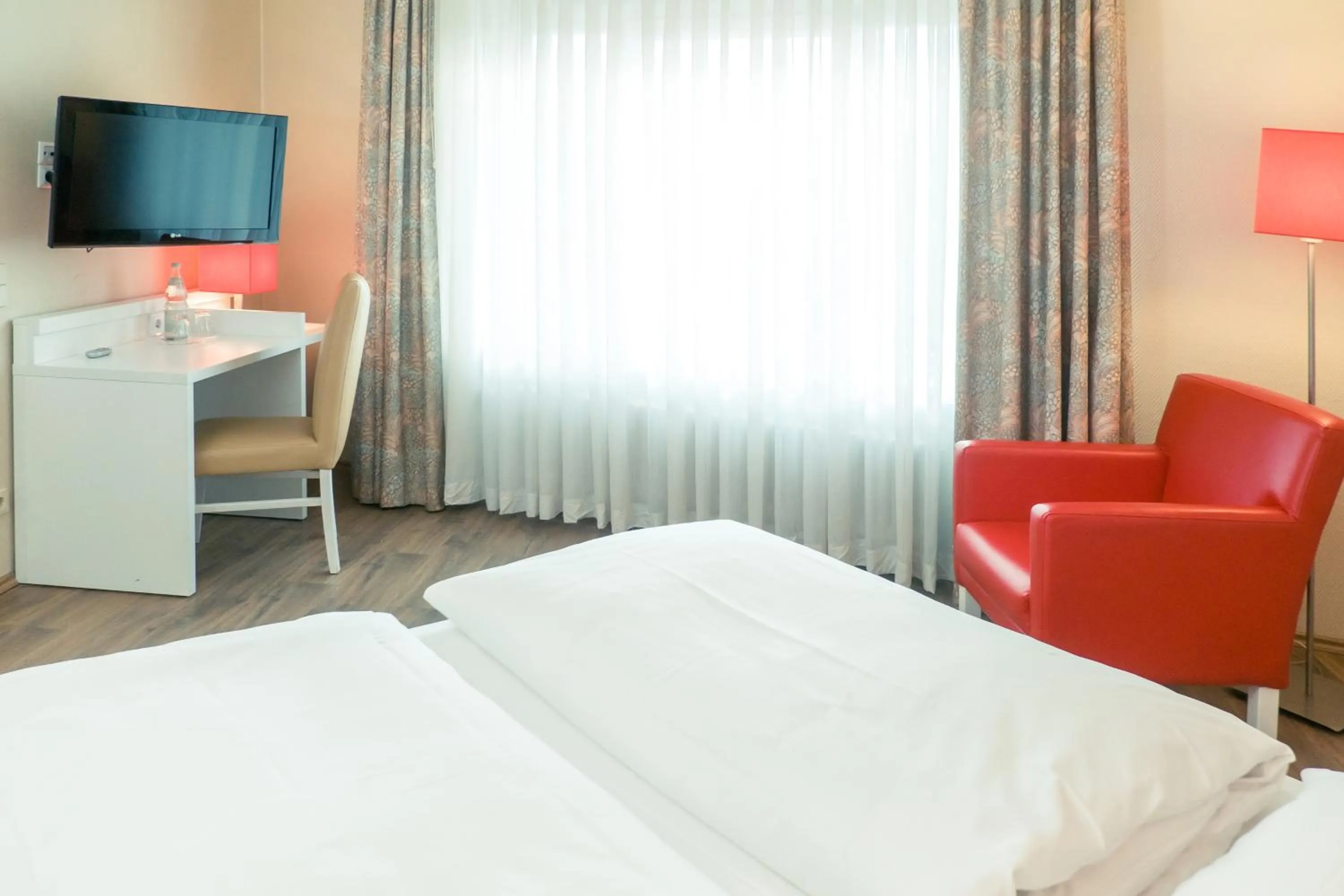 Photo of the whole room, Bed in Hotel Stuttgart Sindelfingen City by Tulip Inn