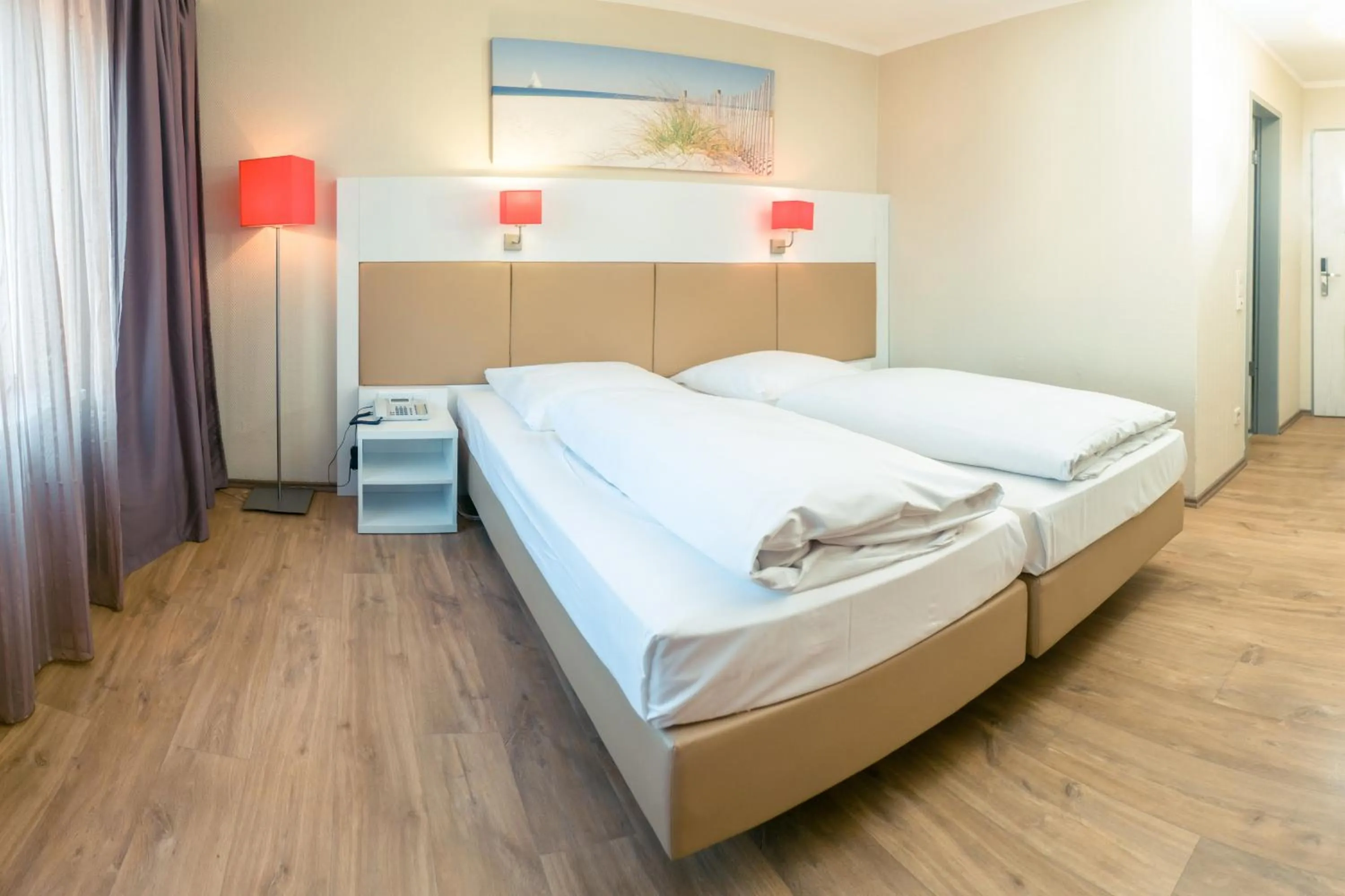 Photo of the whole room, Bed in Hotel Stuttgart Sindelfingen City by Tulip Inn