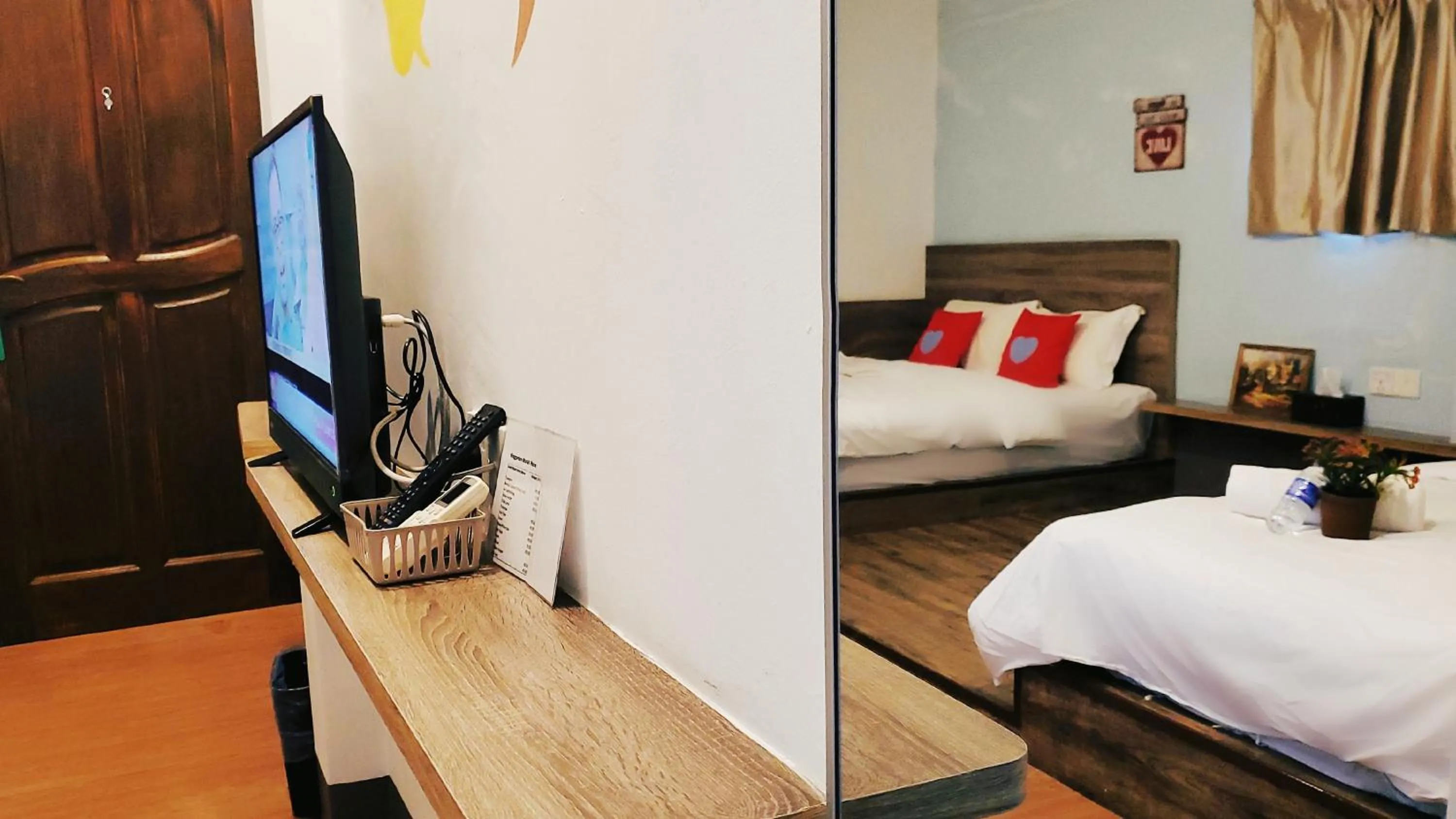 Bed in Winggarden Murals House by JE Boutique Guesthouse