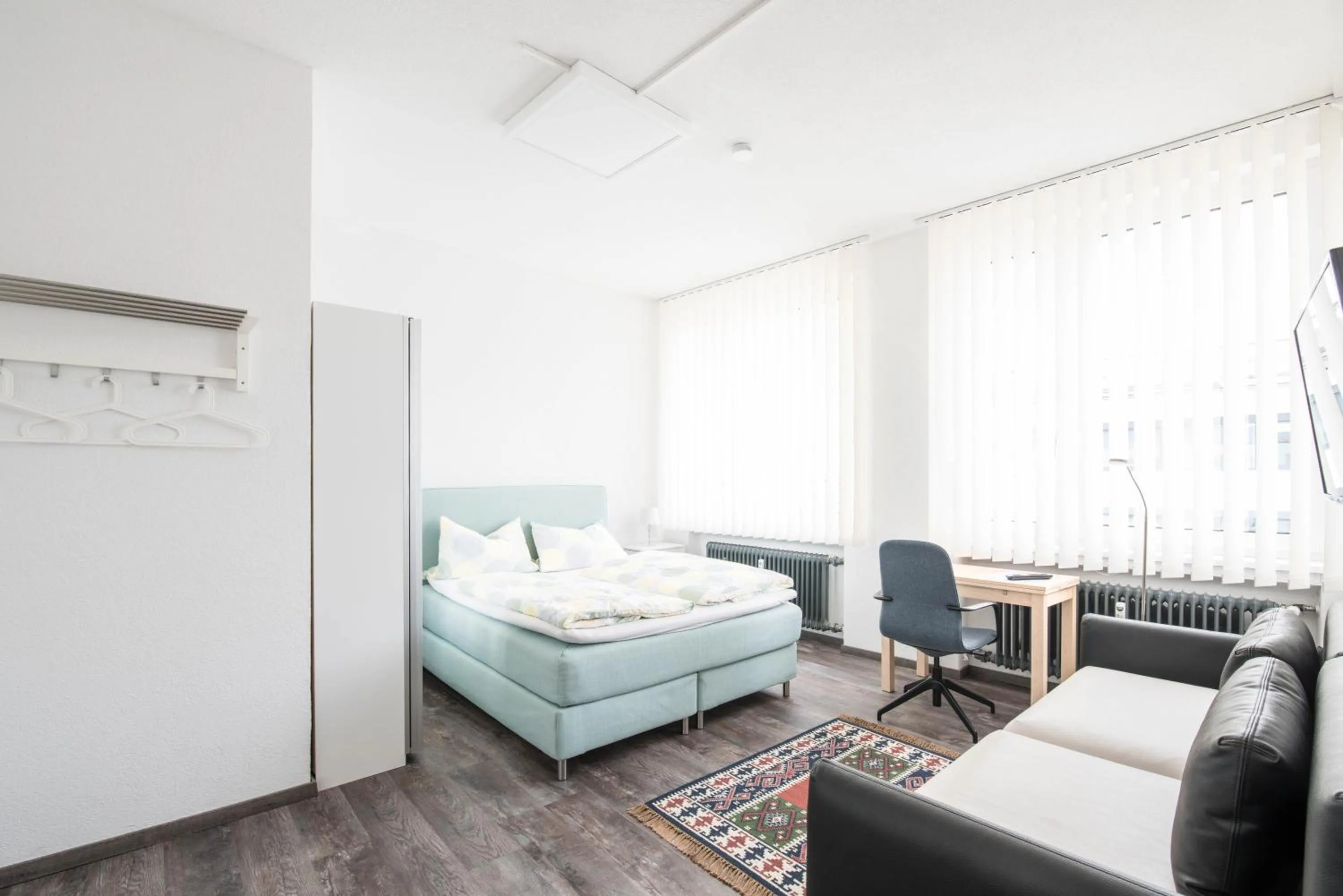 Seating area, Bed in Central Apartments Aalen