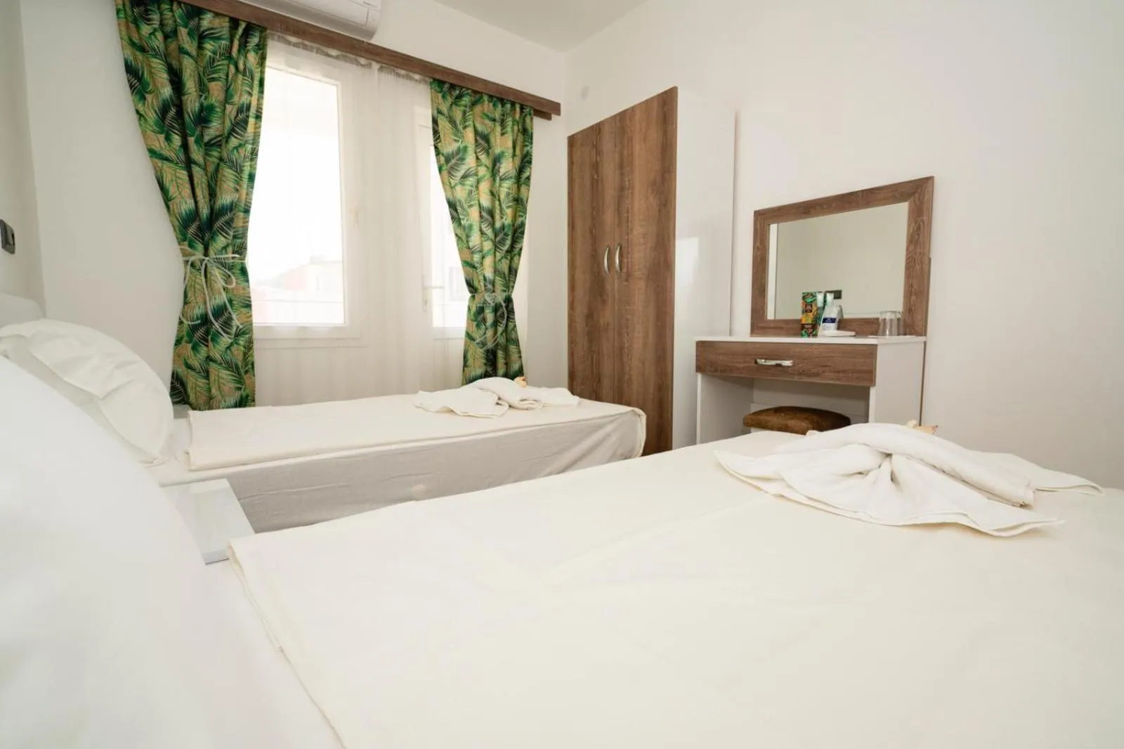 Bed in ESQUIRE HOTELS and LOUNGES