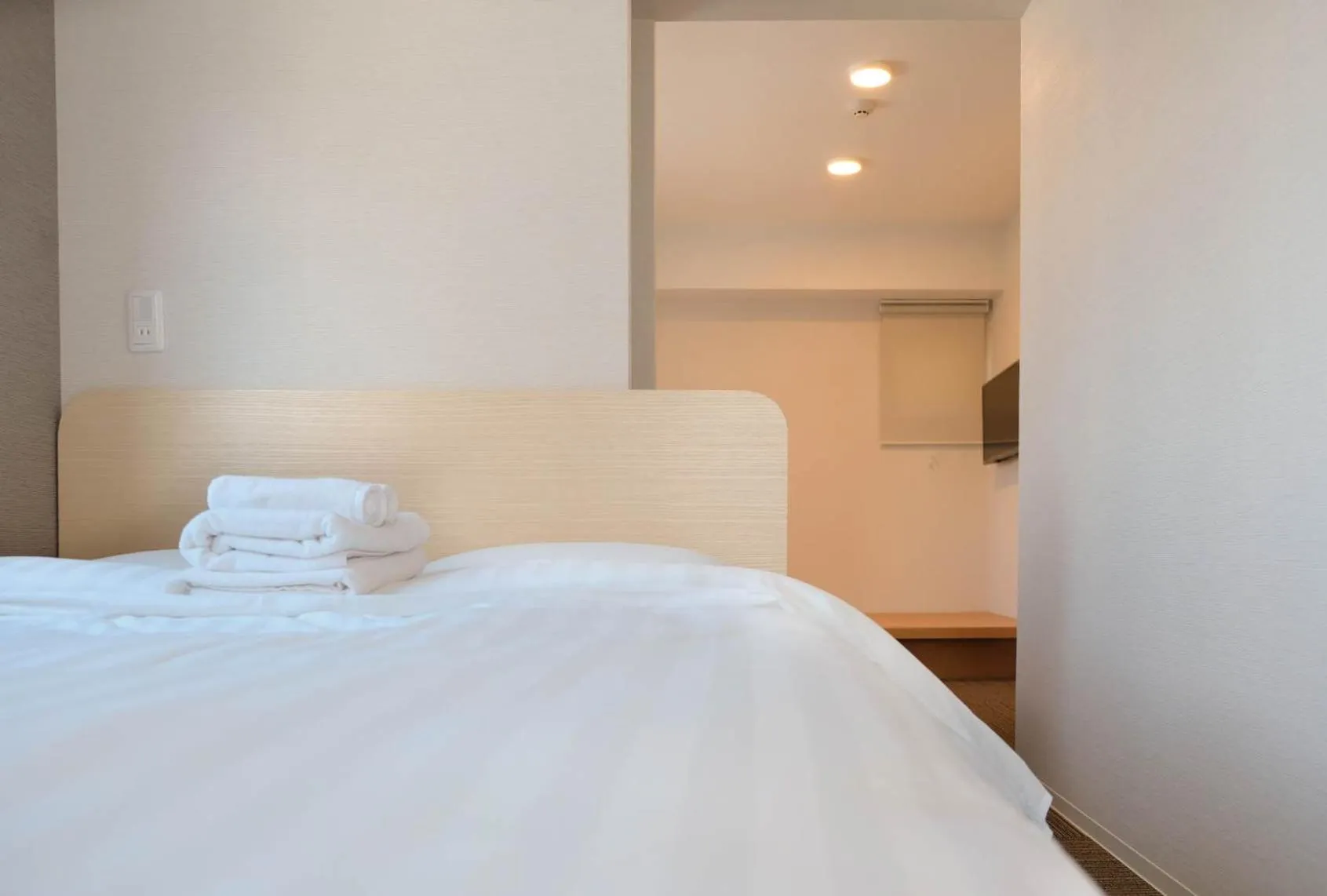 Bed in The Light Inn Tokyo