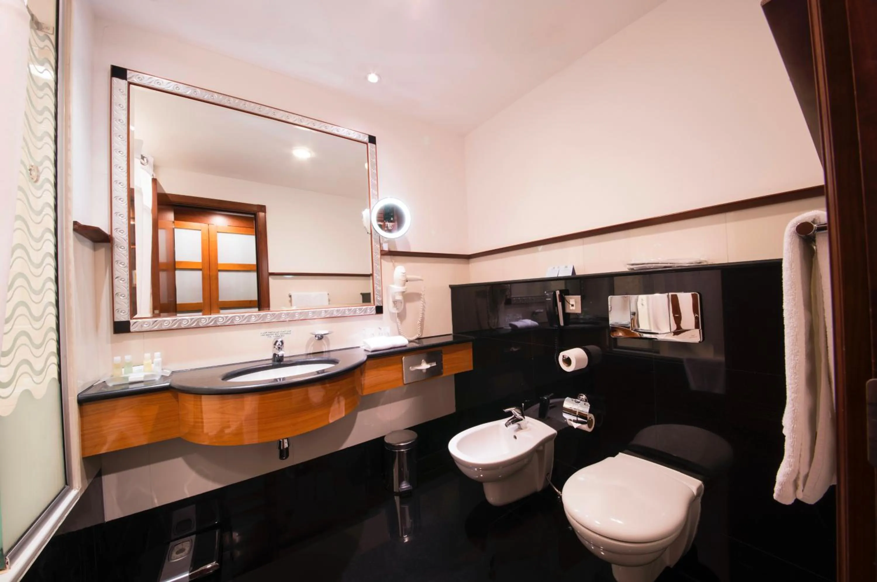 Bathroom in Holiday Inn - Suites Kuwait Salmiya by IHG