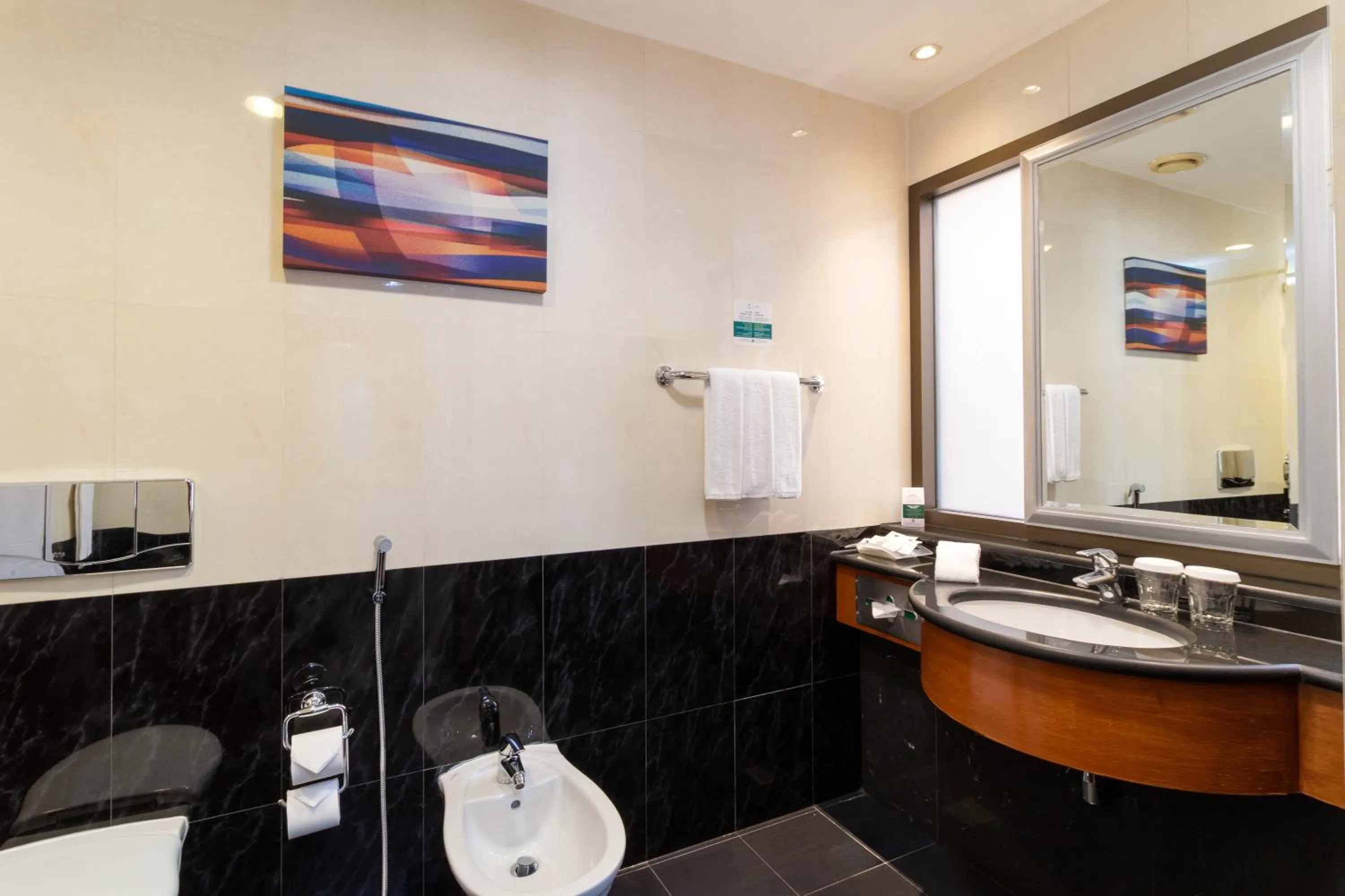Bathroom in Holiday Inn - Suites Kuwait Salmiya by IHG