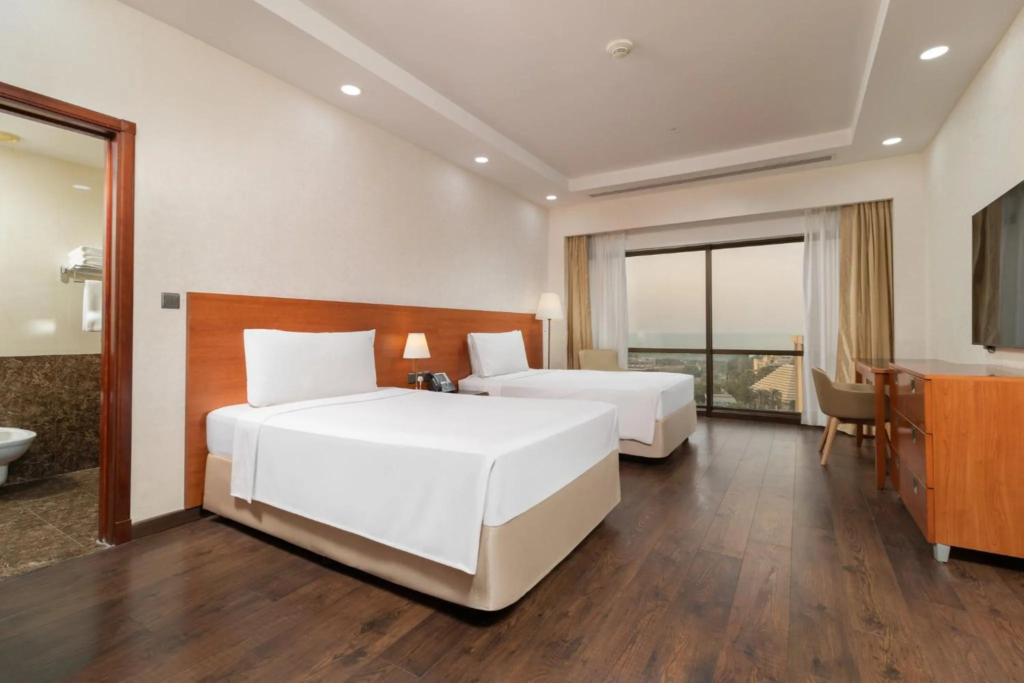 Photo of the whole room, Bed in Holiday Inn - Suites Kuwait Salmiya by IHG