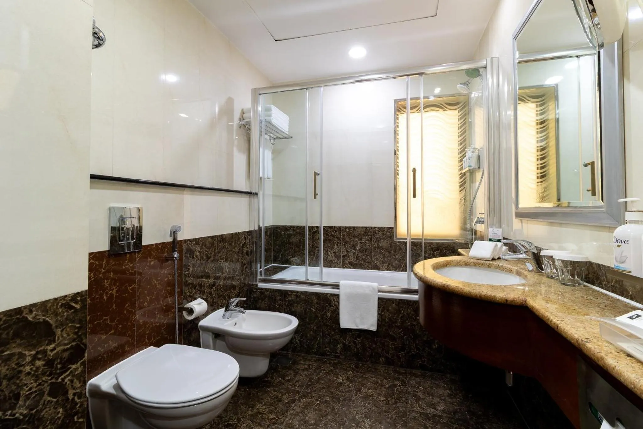 Bathroom in Holiday Inn - Suites Kuwait Salmiya by IHG