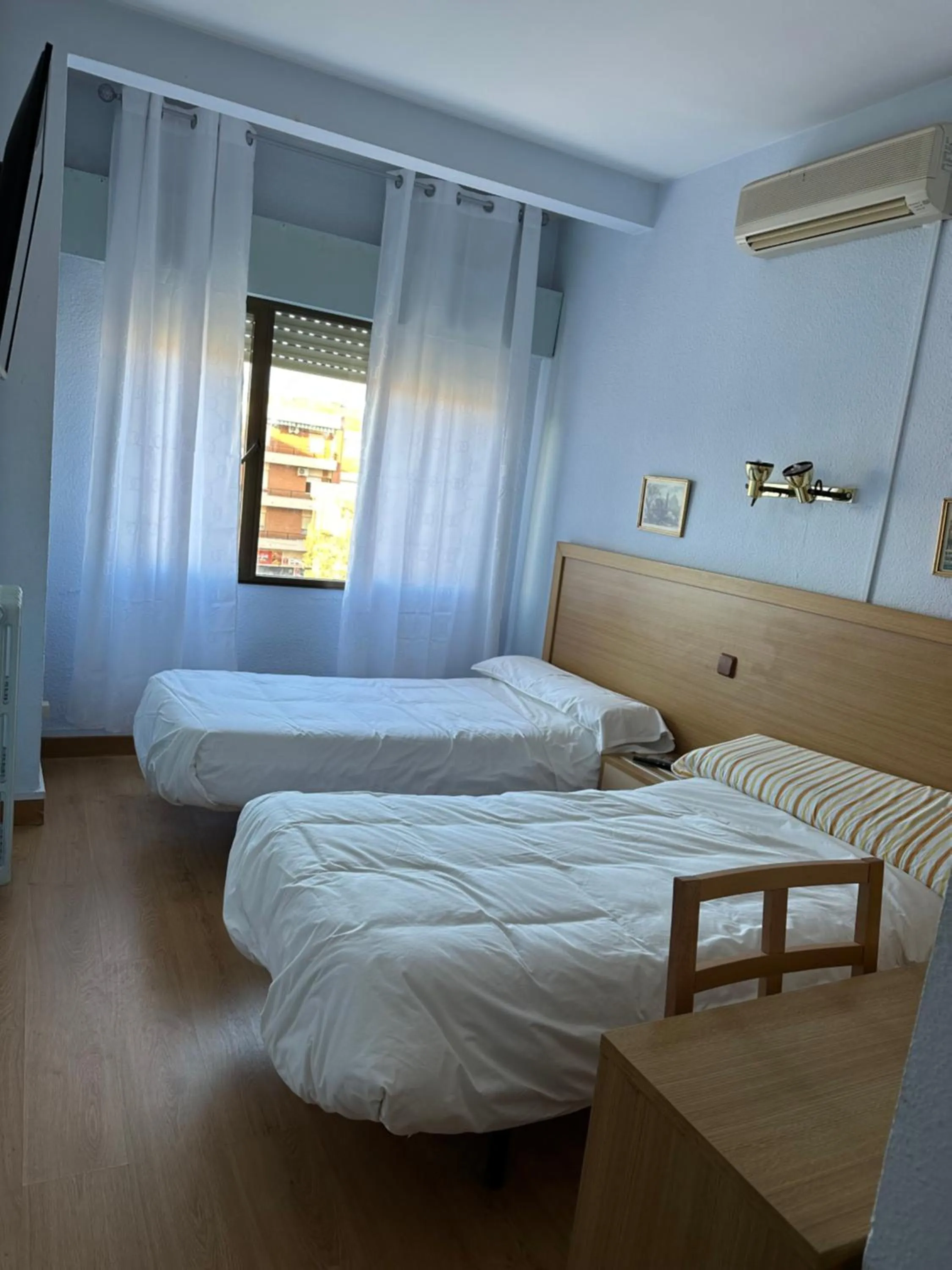 Bed in Hostal agripino y Restaurante asiático