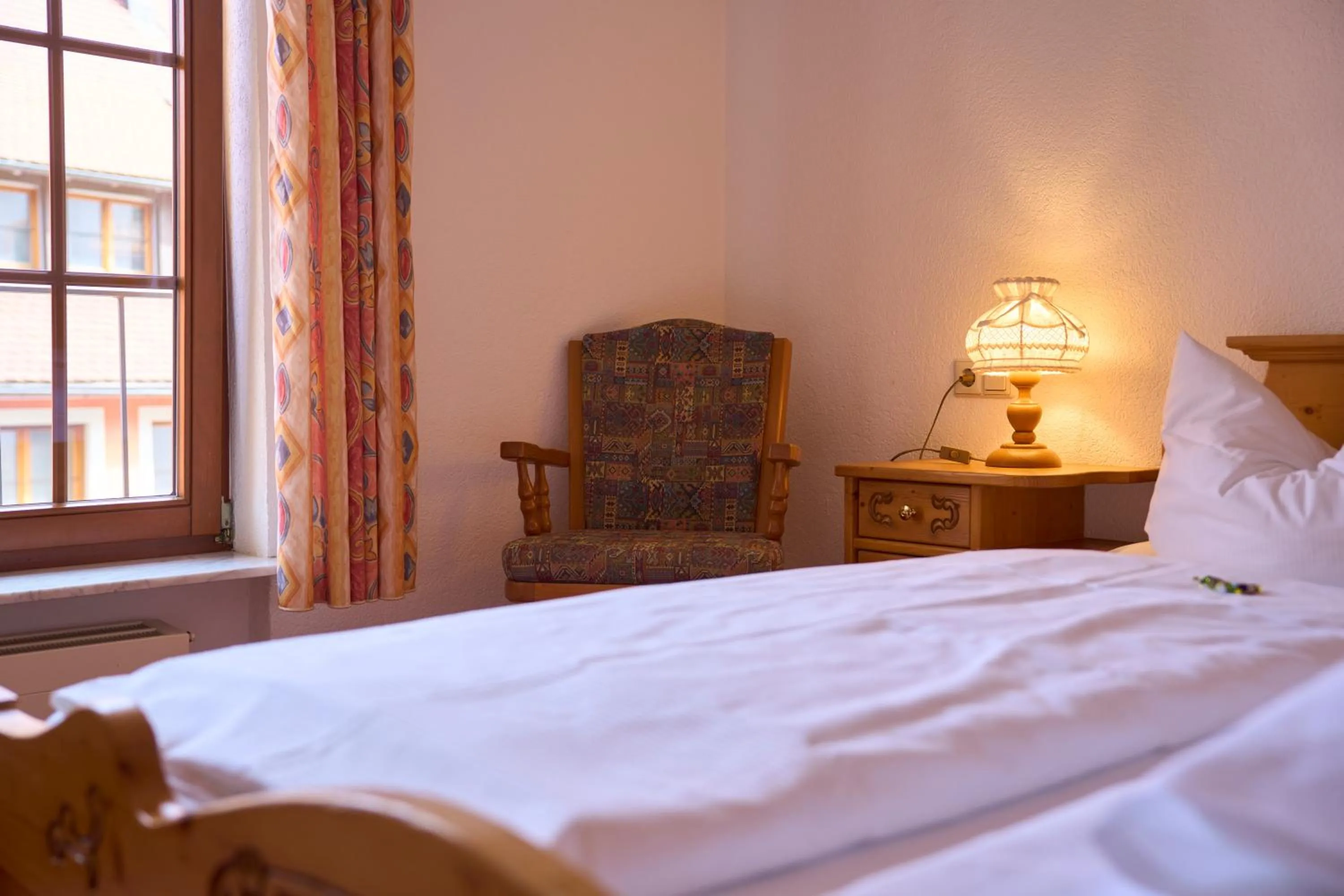 Bed in Hotel der Löwen in Staufen