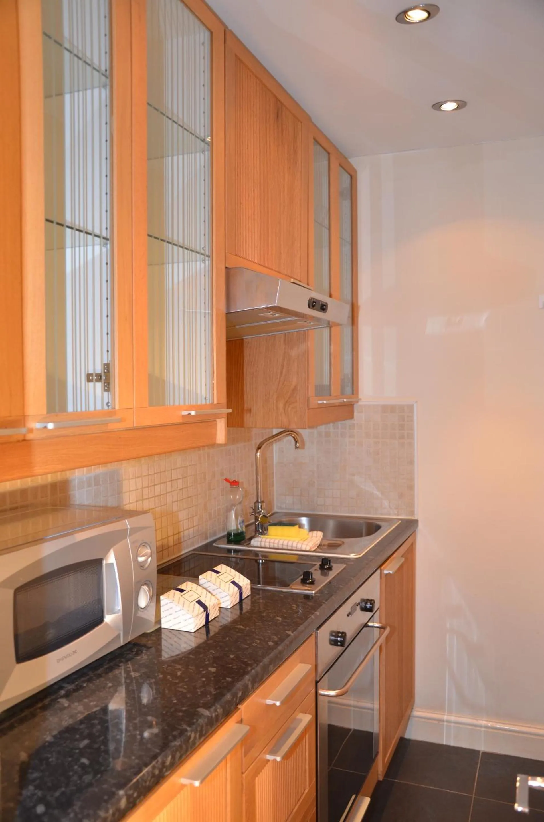 Kitchen or kitchenette in Amber Residence Hotel-Suites