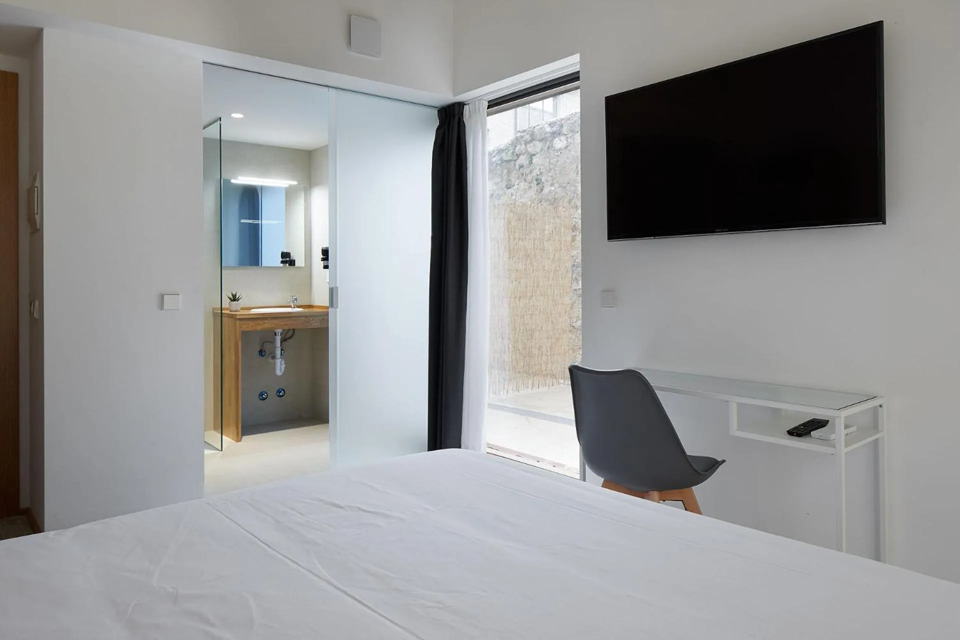 Bed in IRAIPE Estella Rooms Auto Check-in