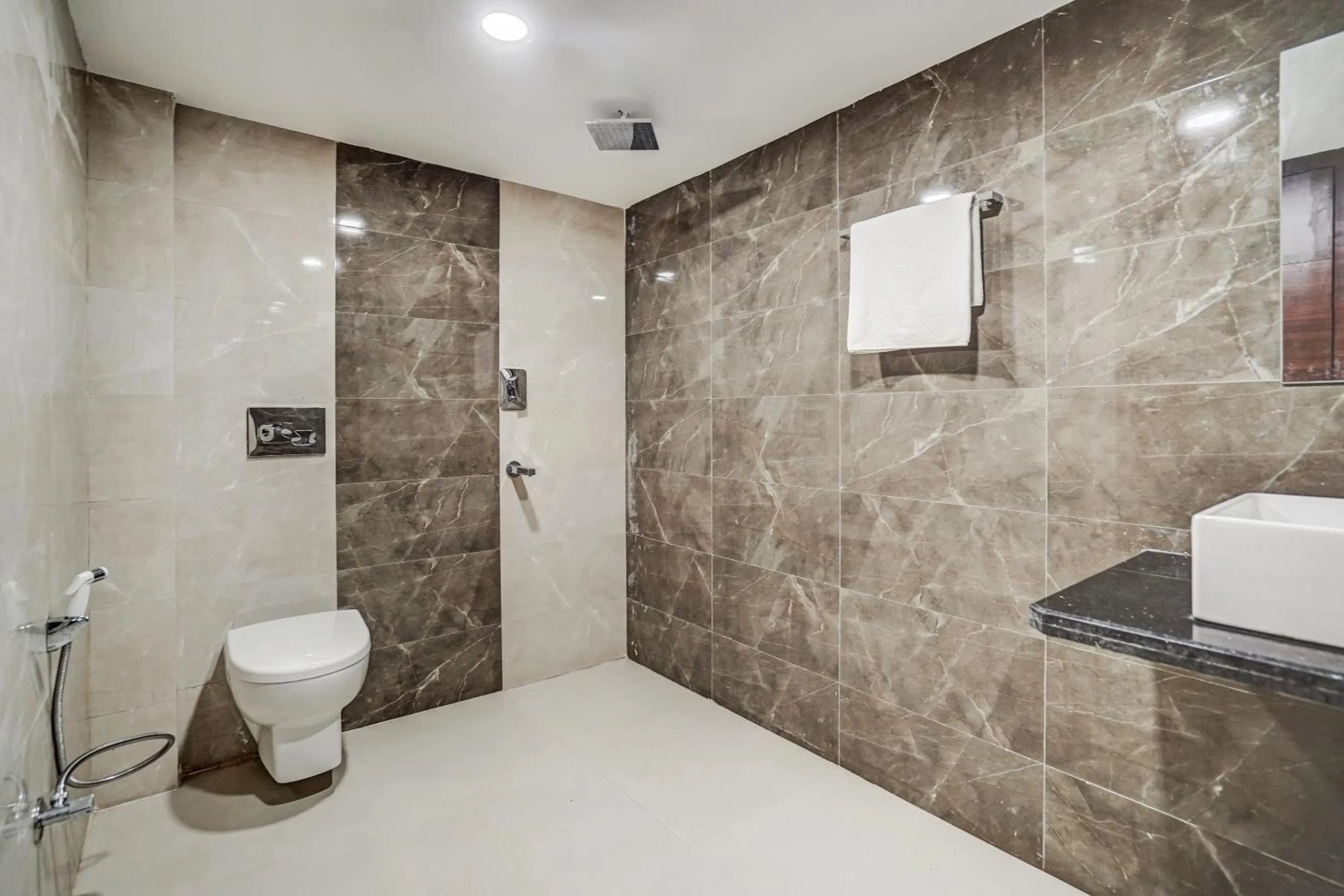 Bathroom in Capital O Sayhallo Prime Residency