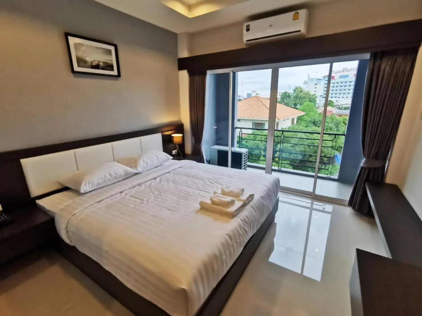 Bed in The Cottage Hotel Udon Thani