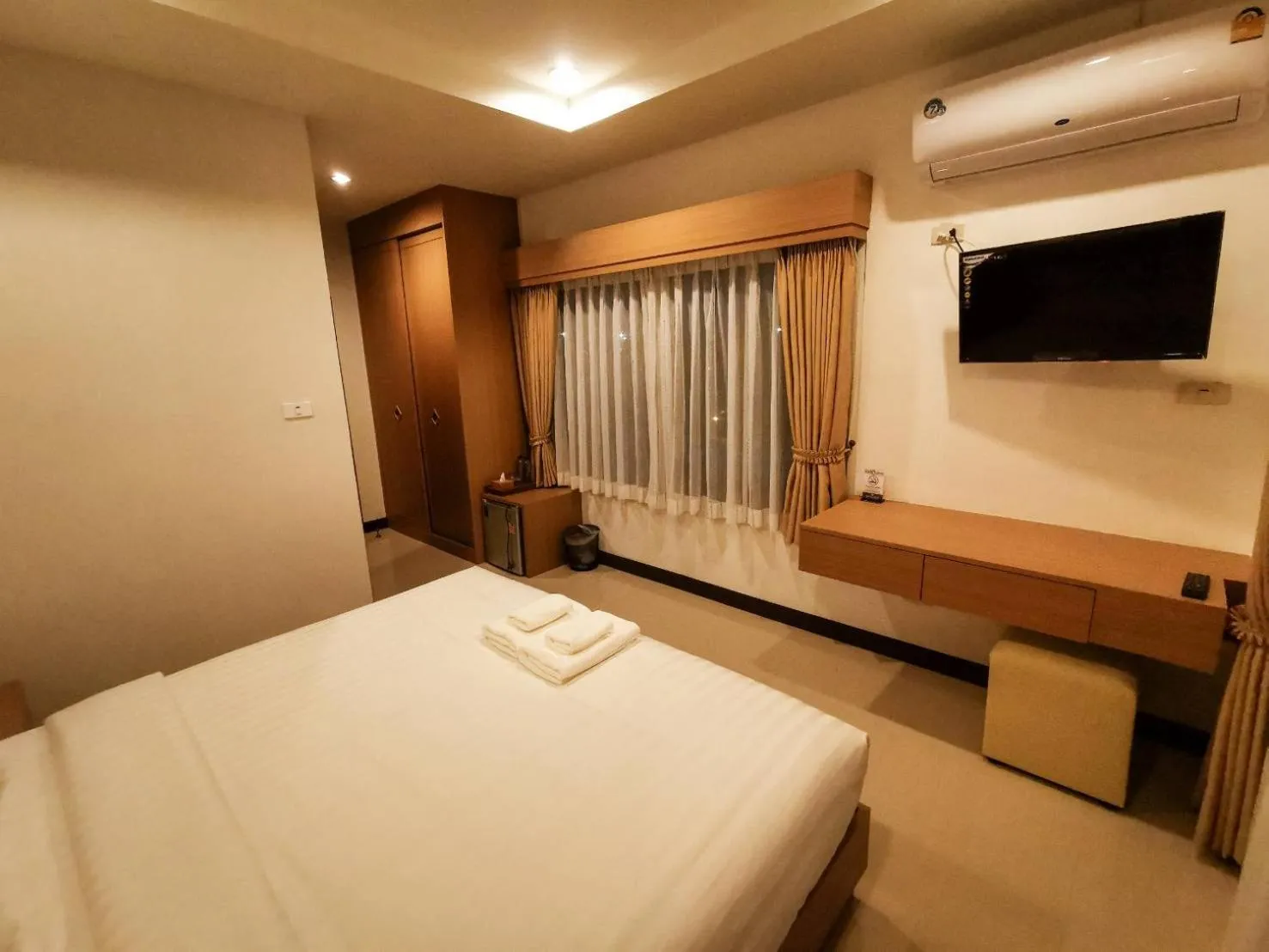 Bed in The Cottage Hotel Udon Thani