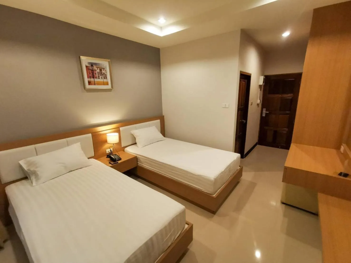 Bed in The Cottage Hotel Udon Thani