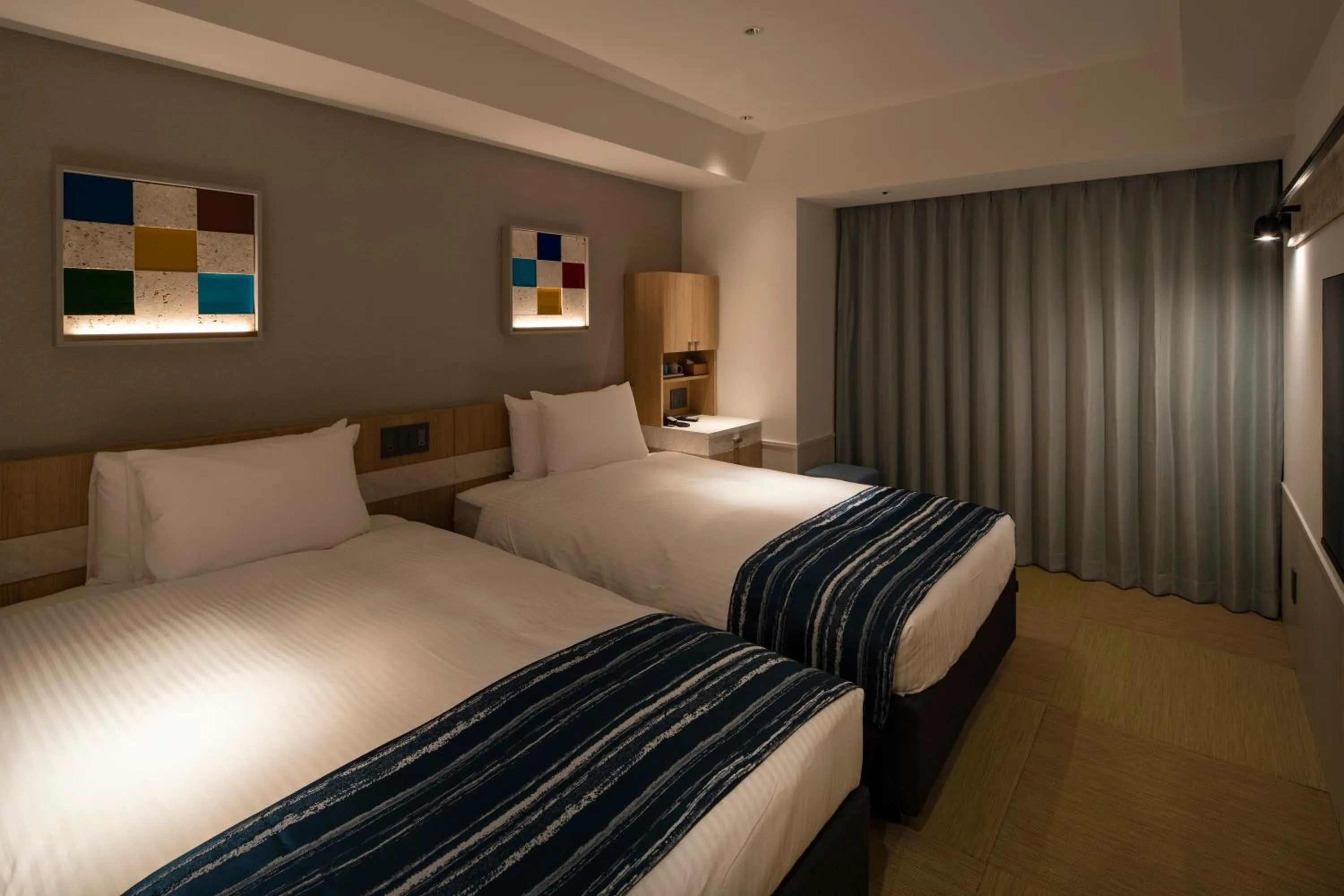 Photo of the whole room, Bed in Okinawa Hinode Resort and Hot Spring Hotel