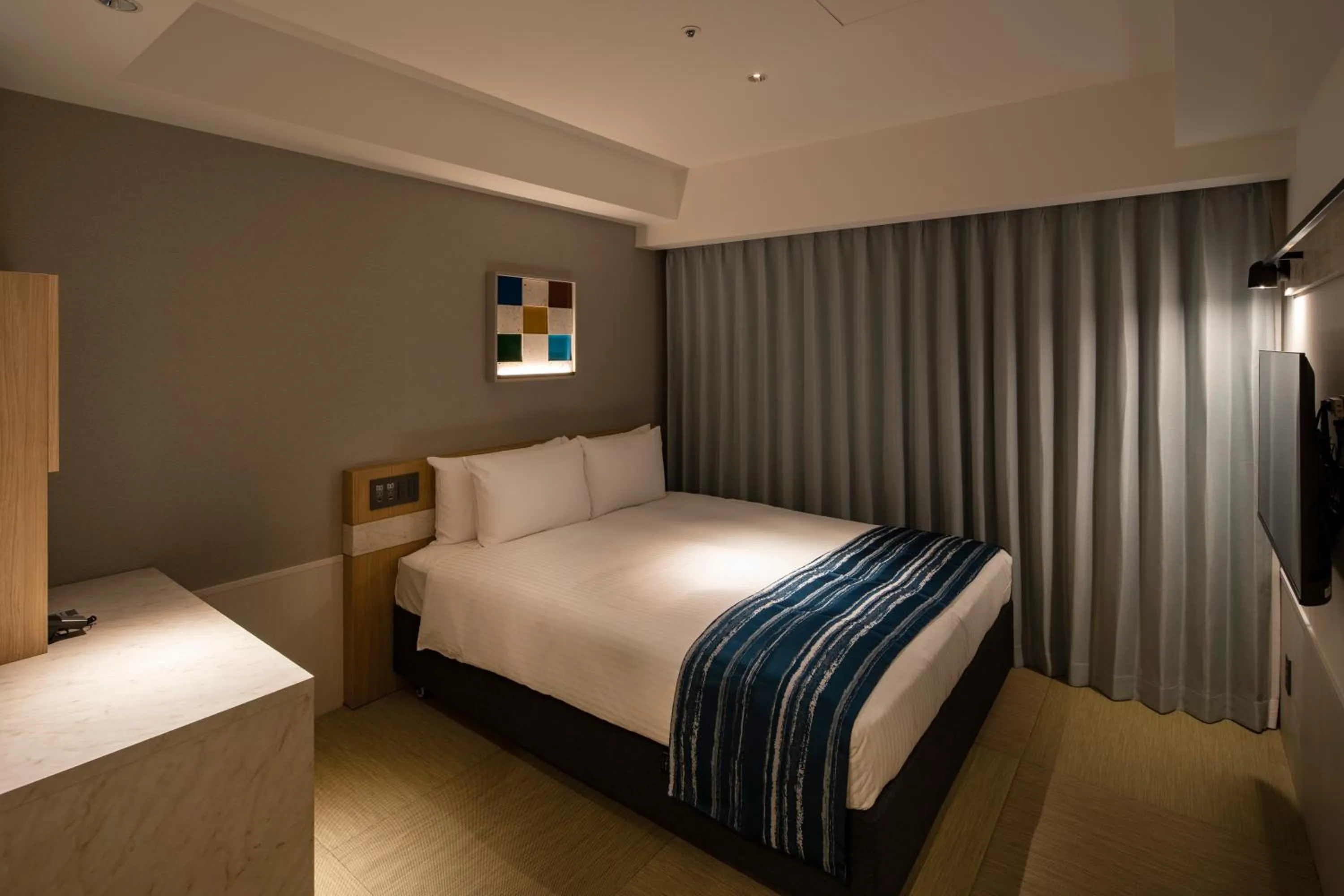 Bed in Okinawa Hinode Resort and Hot Spring Hotel