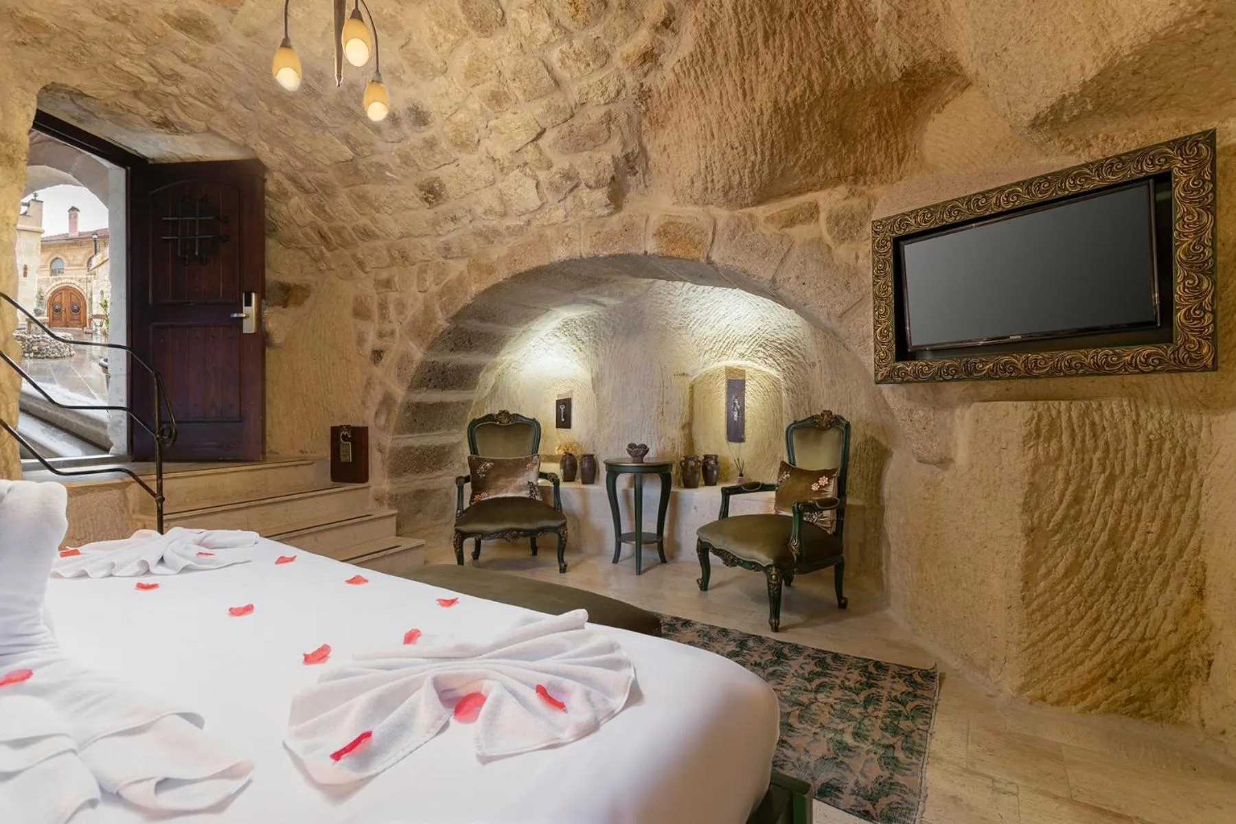 Seating area, Bed in Elysion Cave Suites
