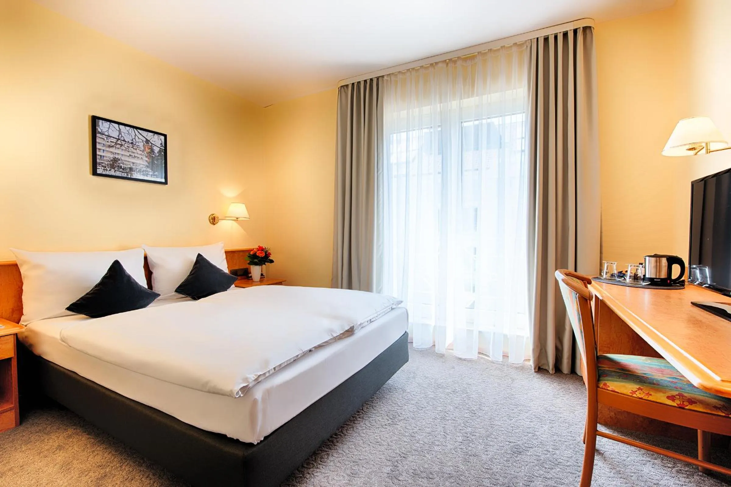 Bed in ACHAT Hotel Bad Dürkheim