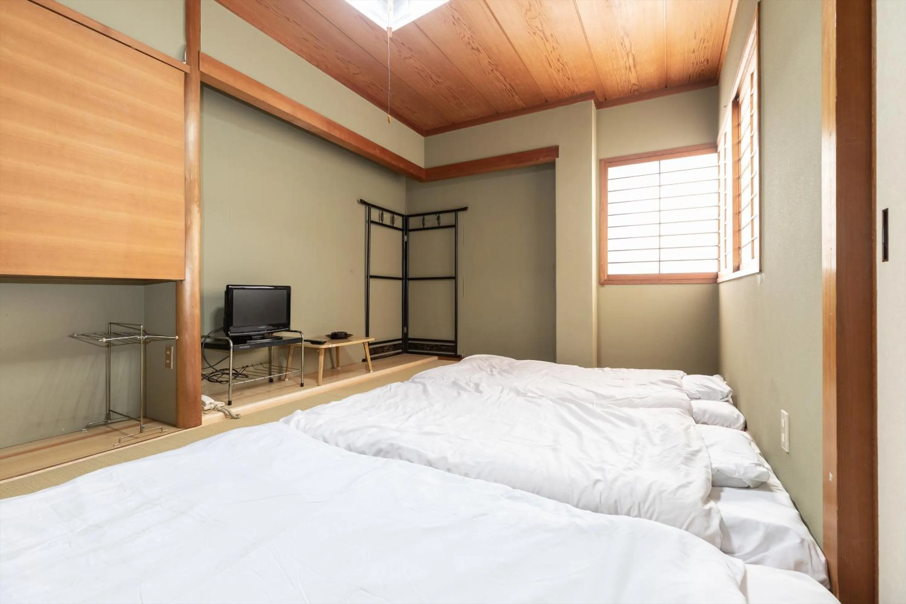 Bed in Tabist Futaba Ryokan Tatsuno