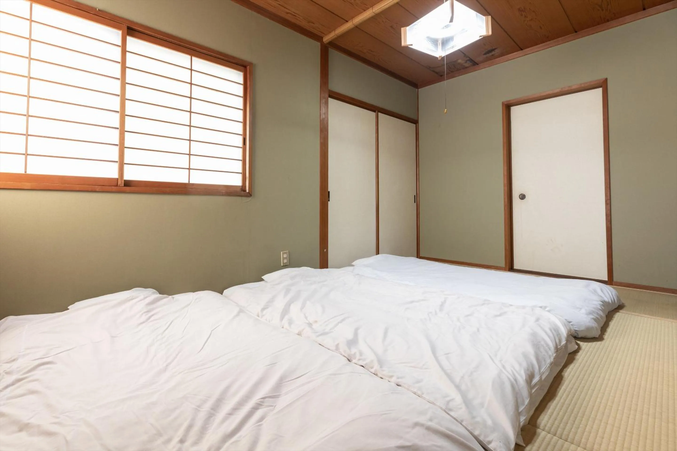 Bed in Tabist Futaba Ryokan Tatsuno