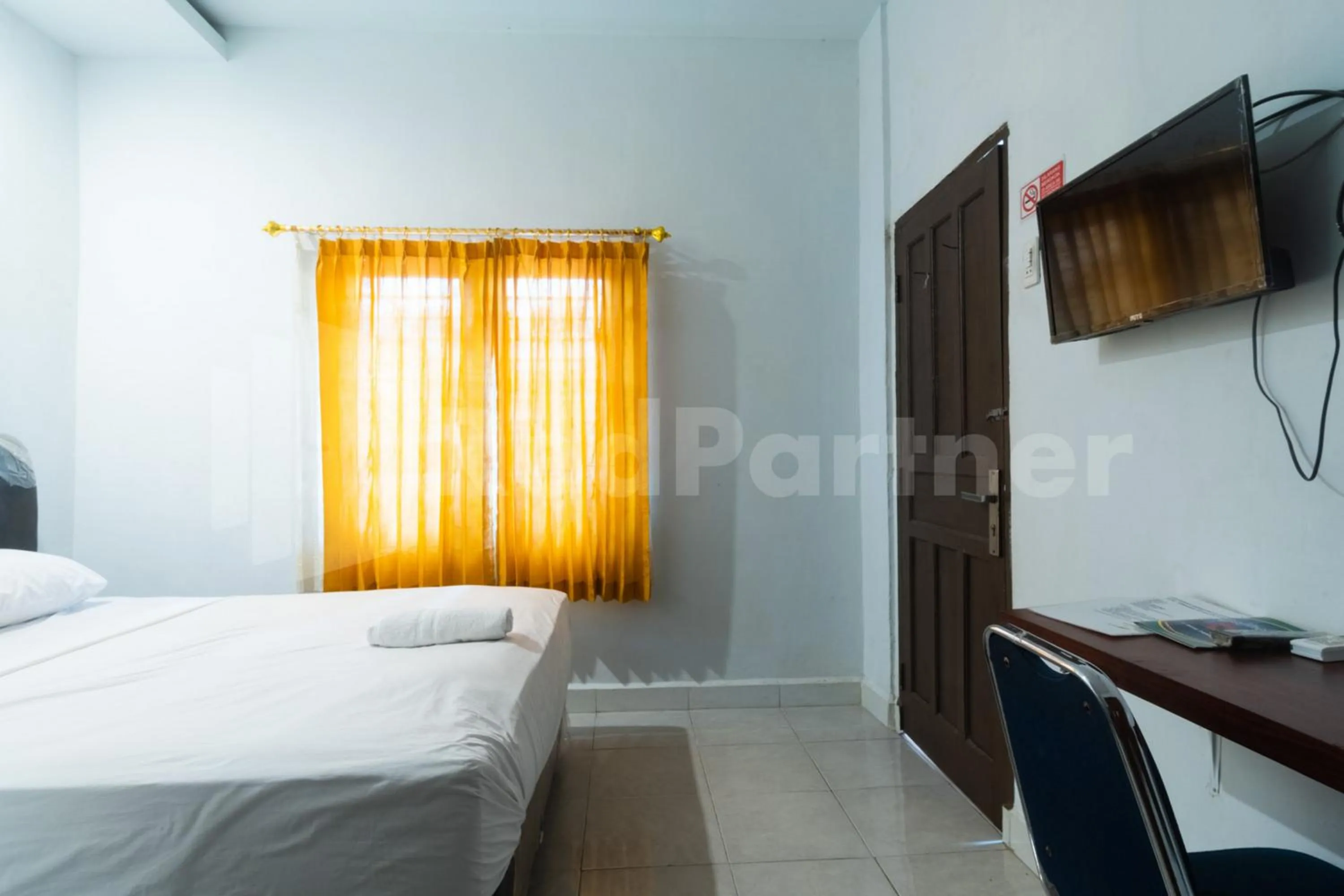 Bed in Teratai Guesthouse at RS Adam Malik Medan Mitra RedDoorz