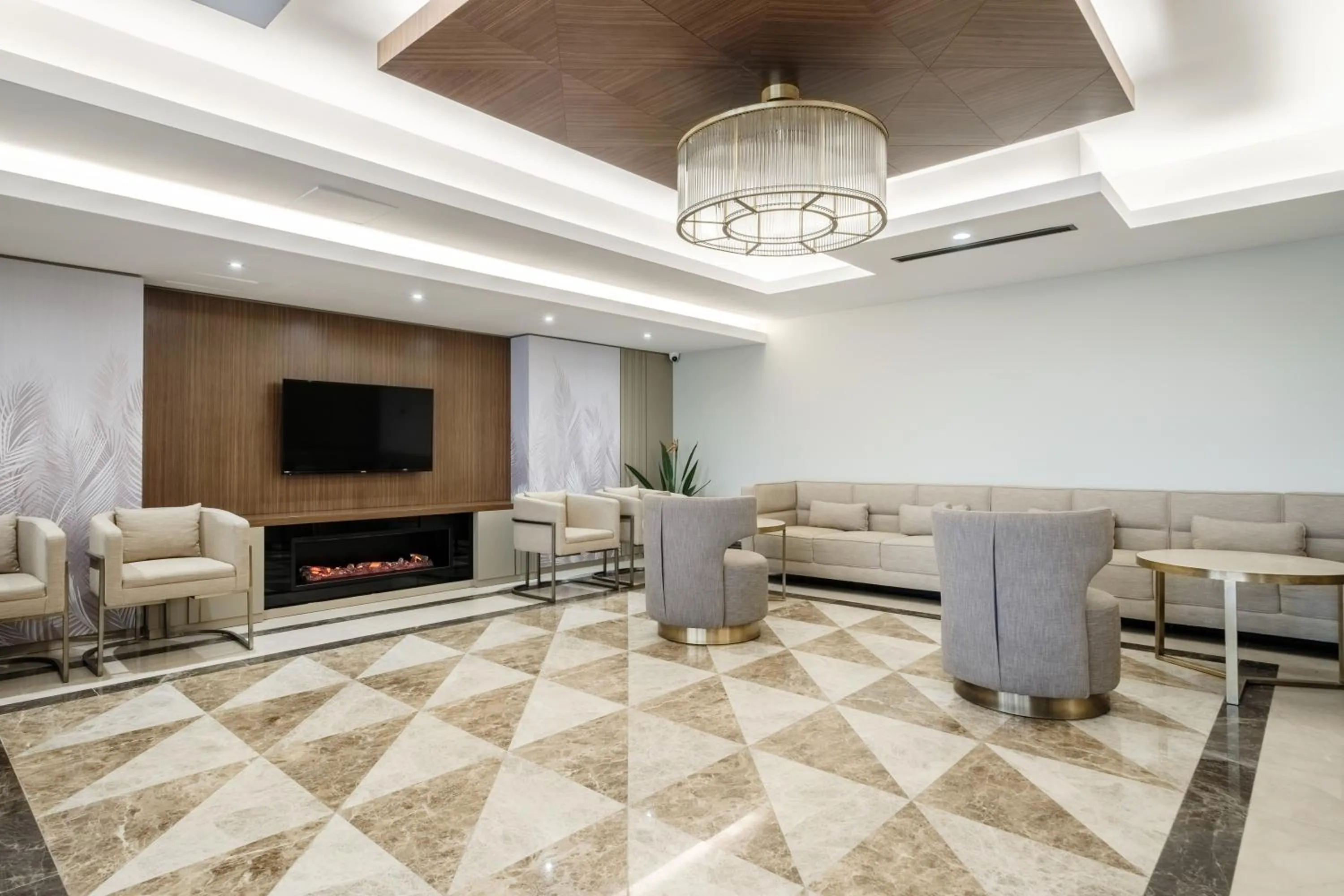 Seating area in Grand Residence by NewInn