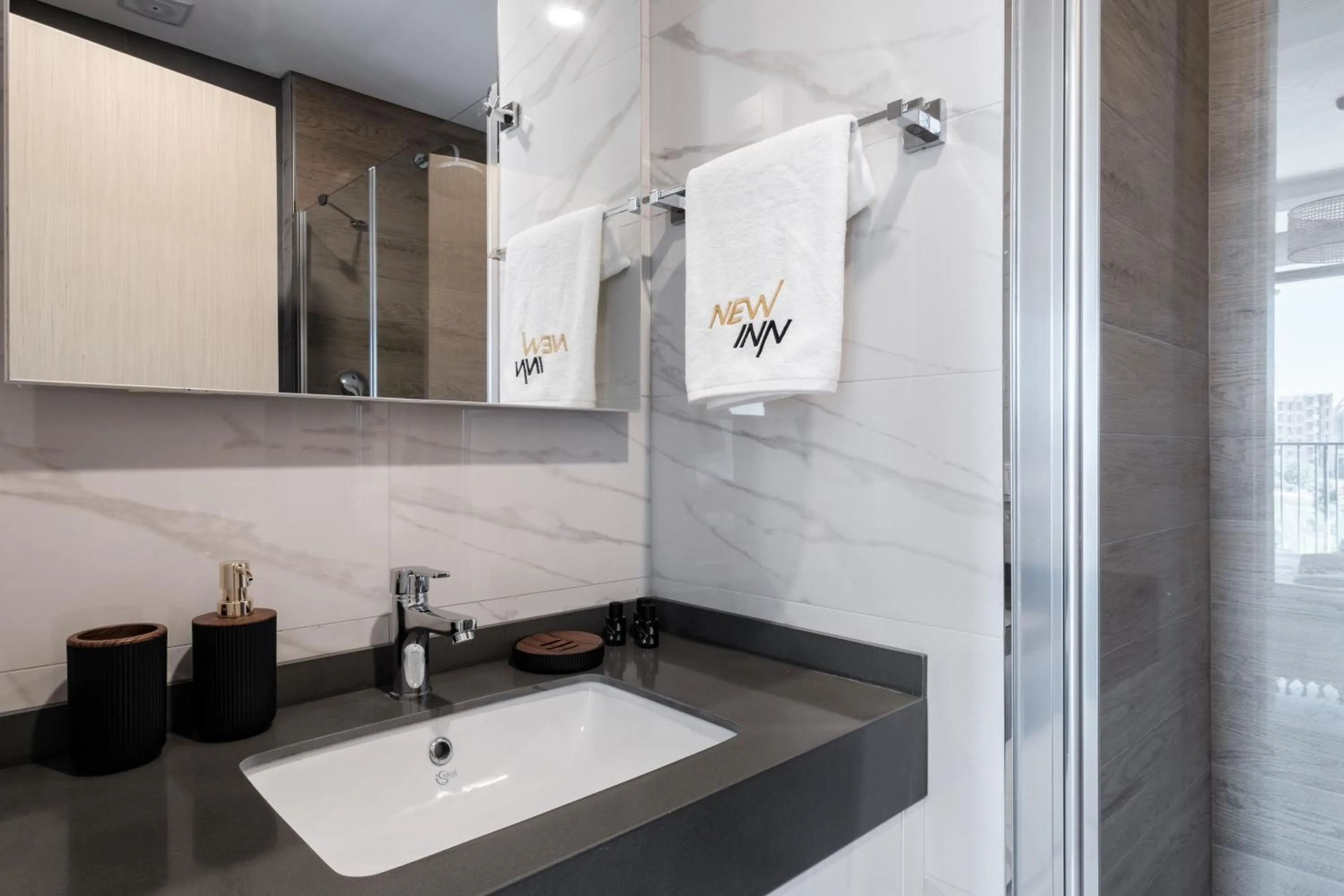 Bathroom in Grand Residence by NewInn