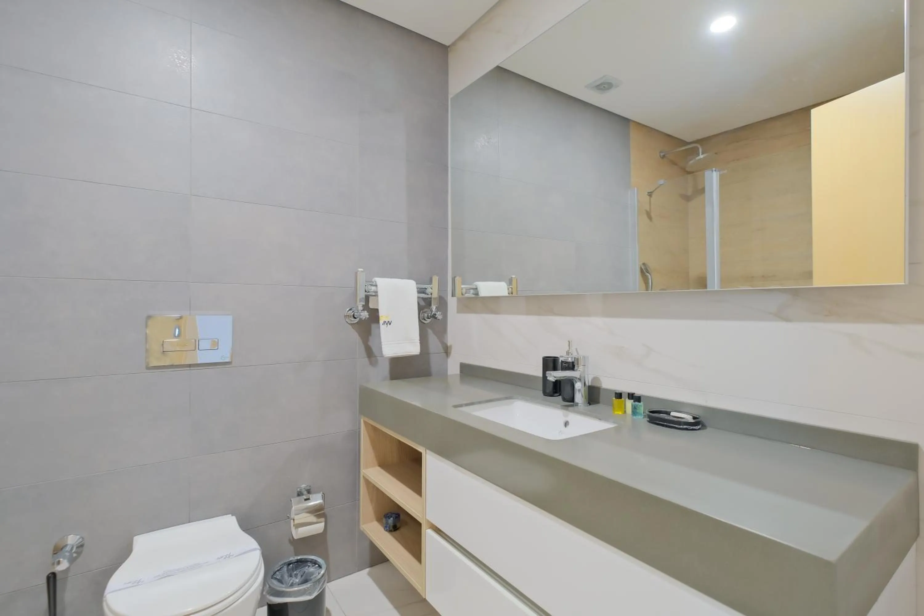 Bathroom in Grand Residence by NewInn