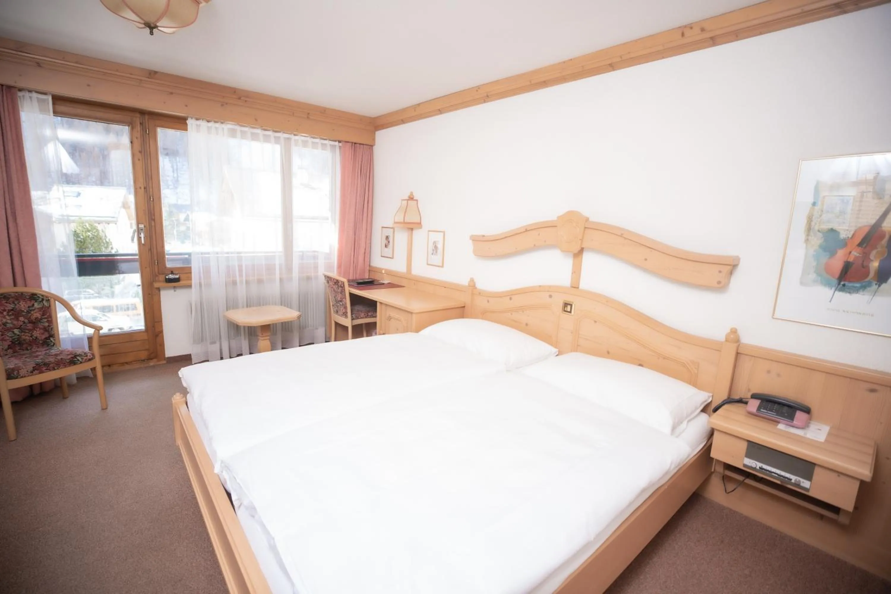 Bed in Hotel Alpenhof