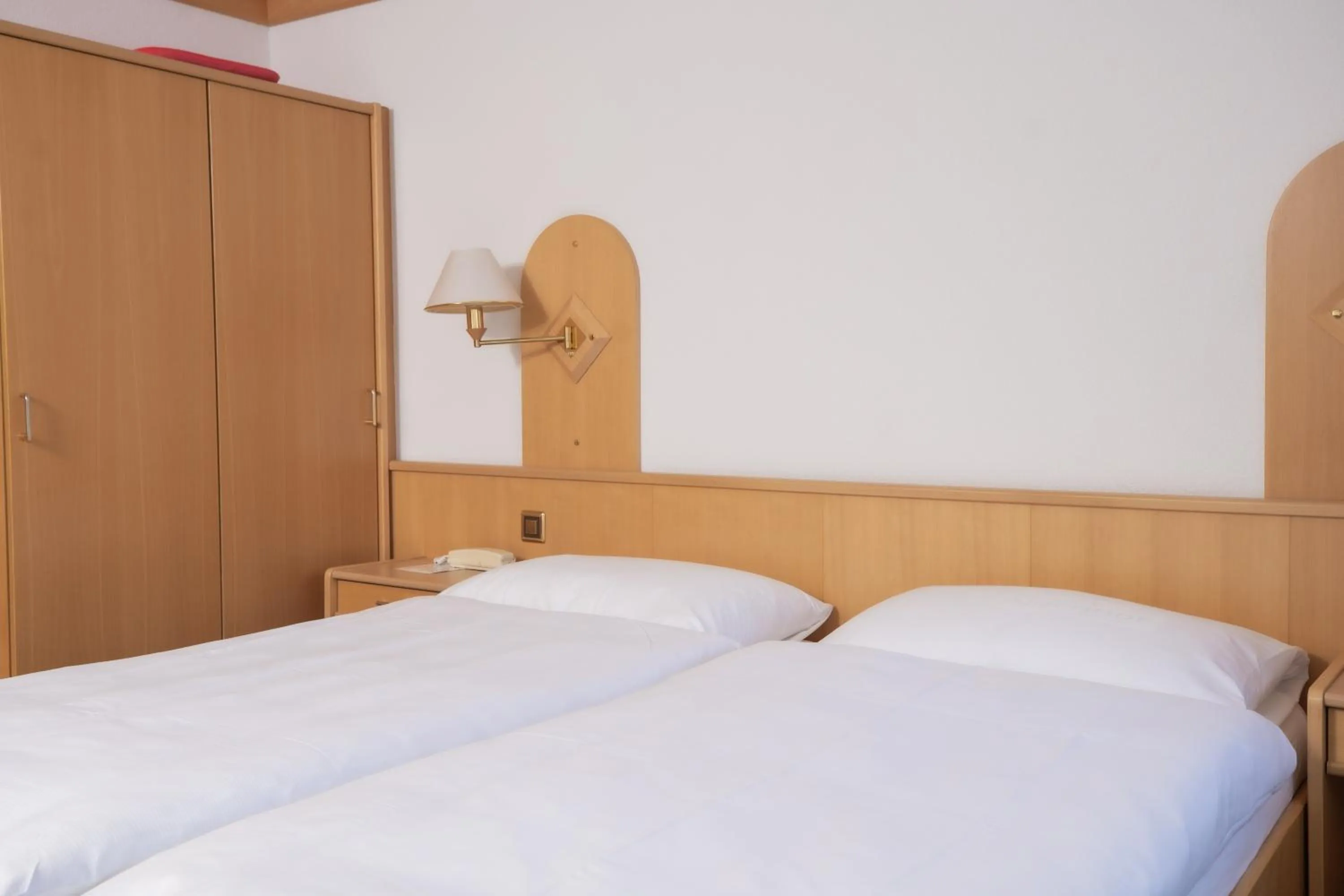 Bed in Hotel Alpenhof