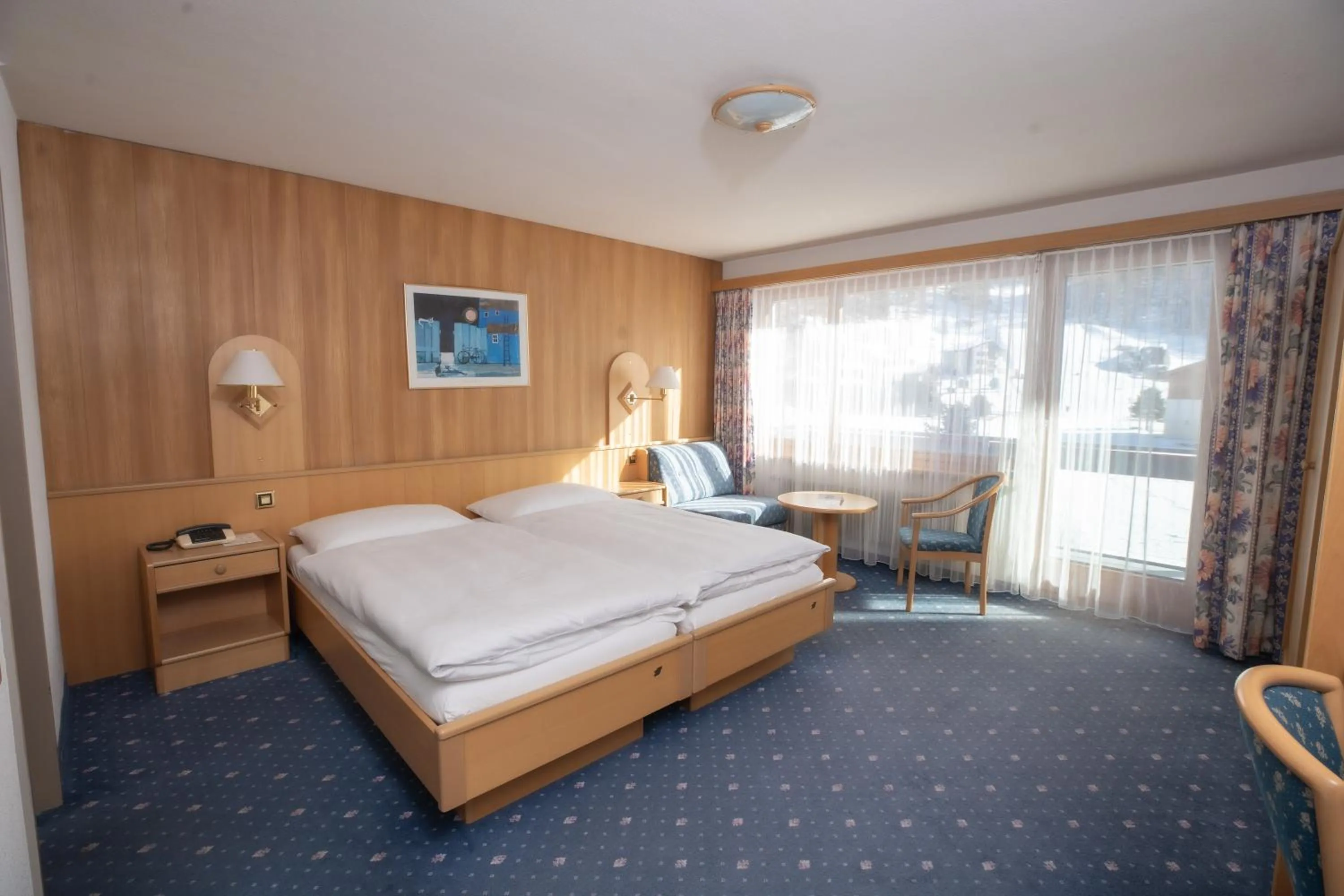 Bed in Hotel Alpenhof