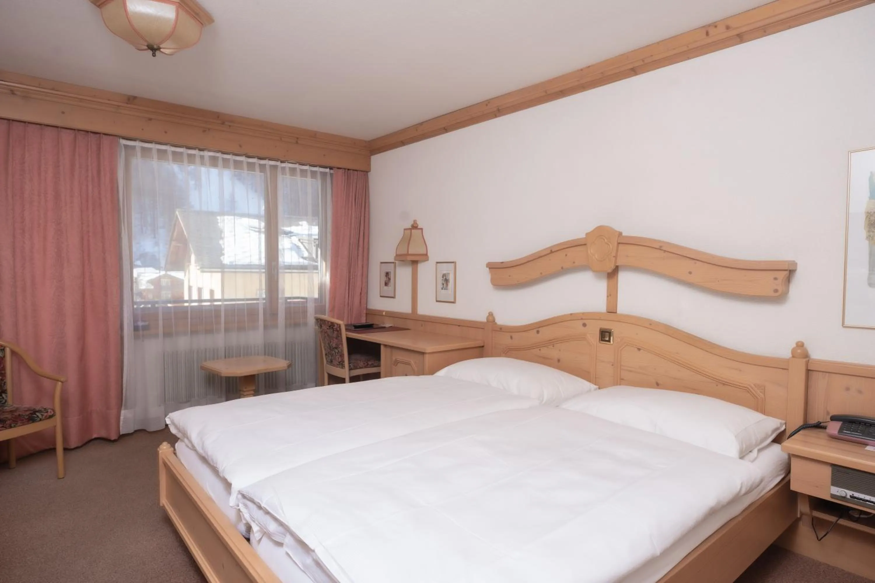 Bed in Hotel Alpenhof