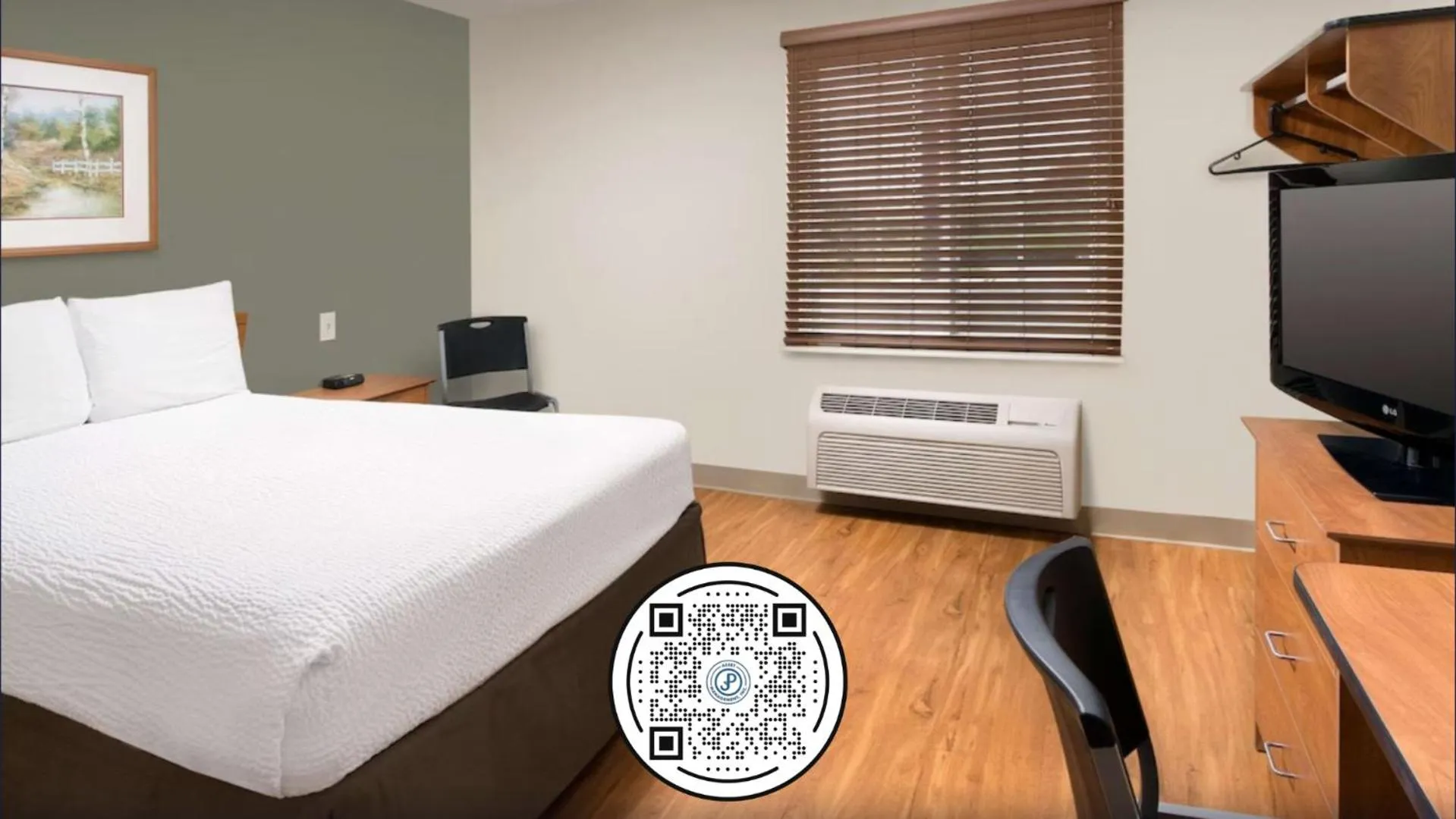 Bed in WoodSpring Suites St Louis Arnold