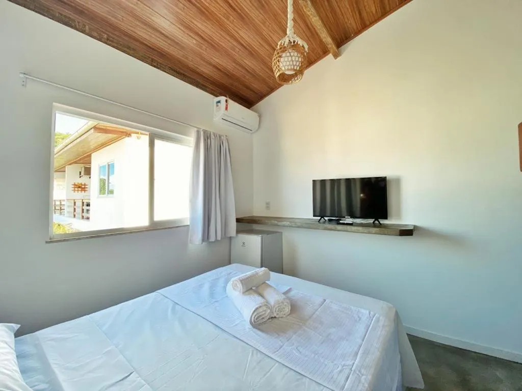 Bed in Pousada Primeira Praia Suítes