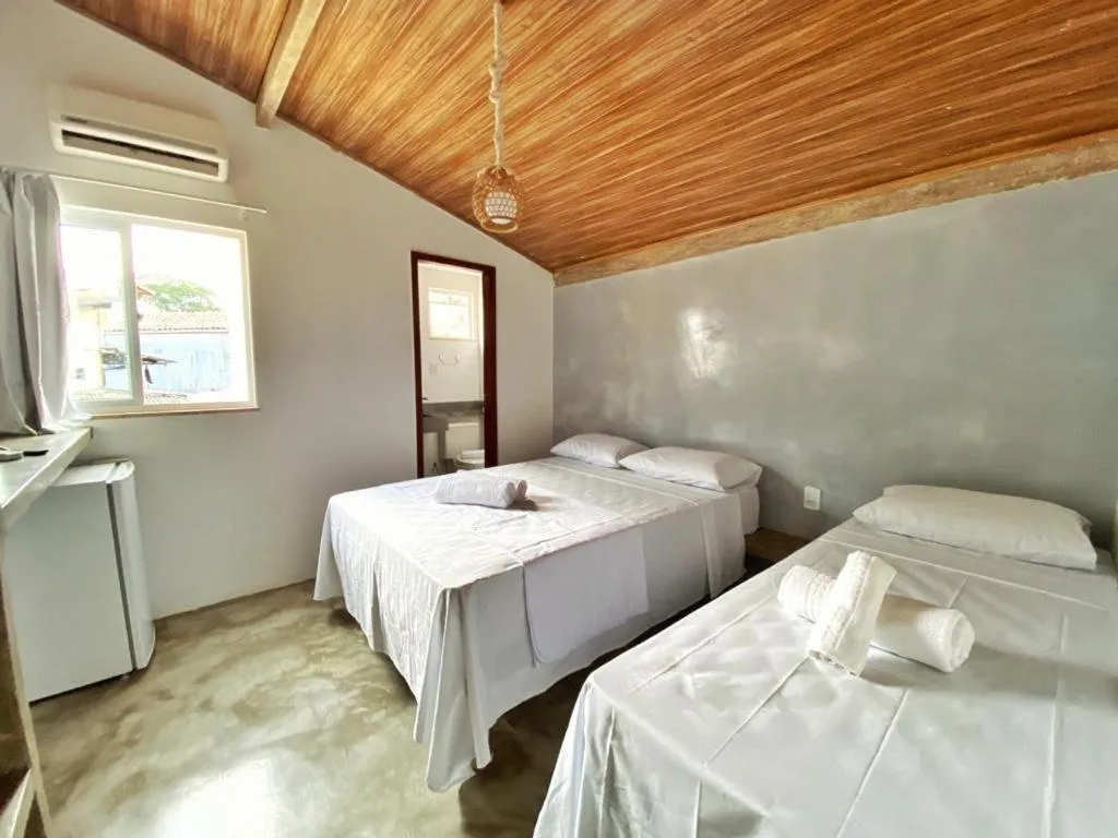 Bed in Pousada Primeira Praia Suítes